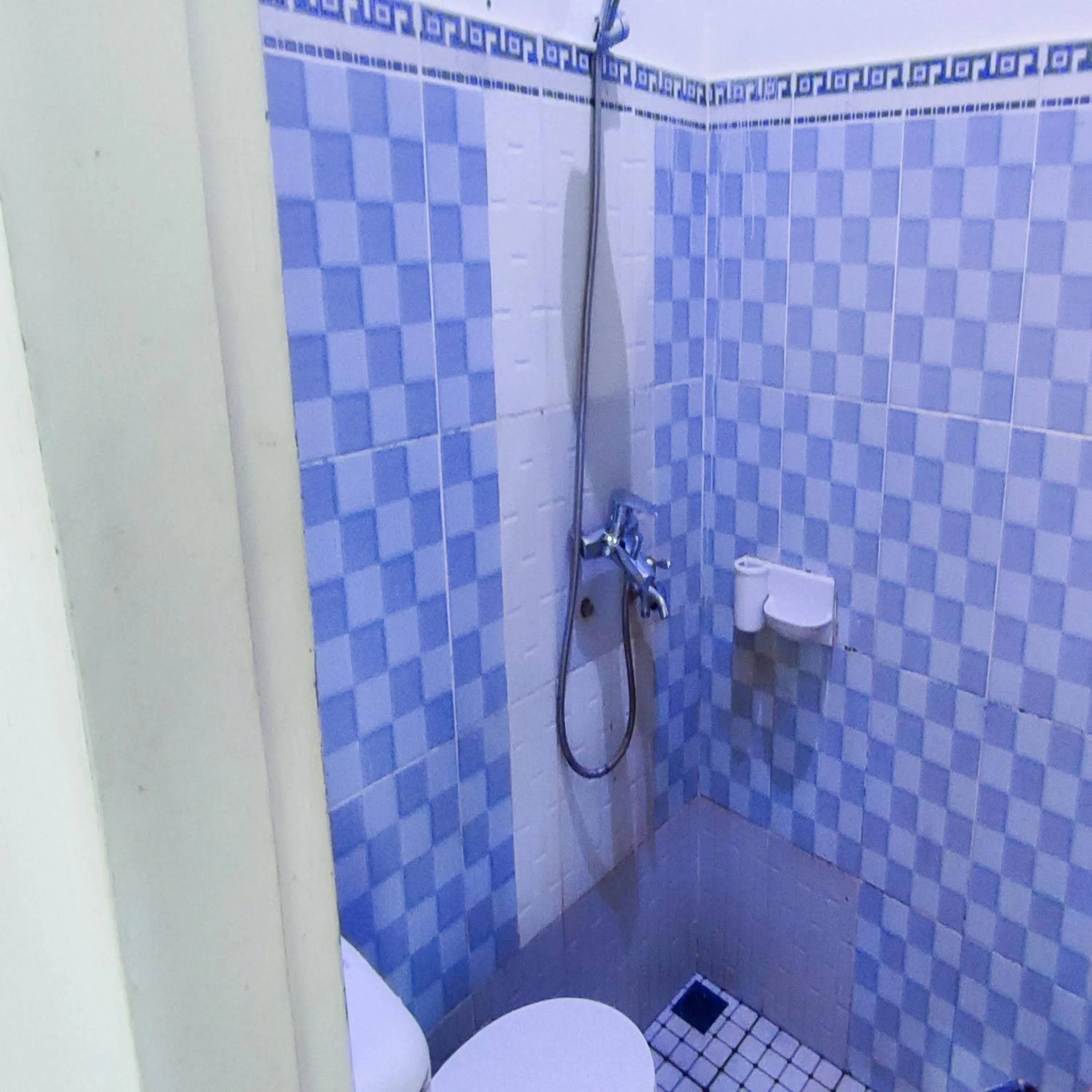 Bathroom in RedDoorz Syariah at Khalifi Guest House Padang