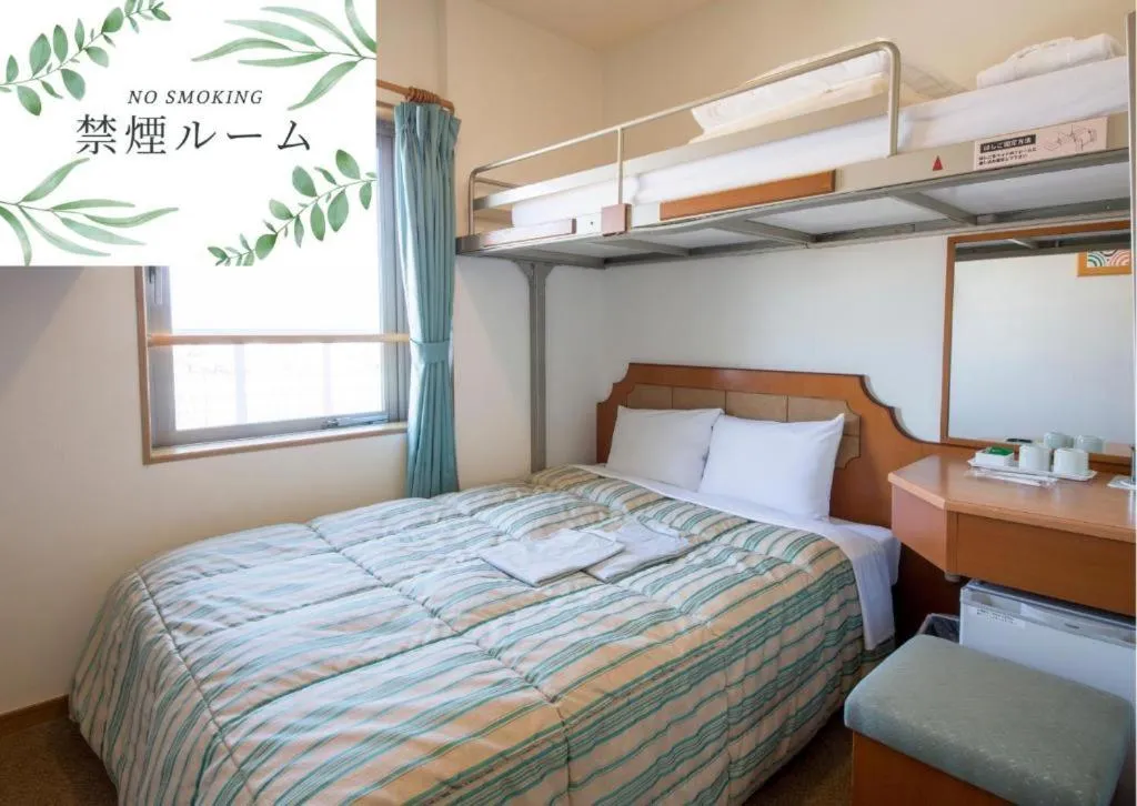 Bed in Hyper Hotel Komatsu