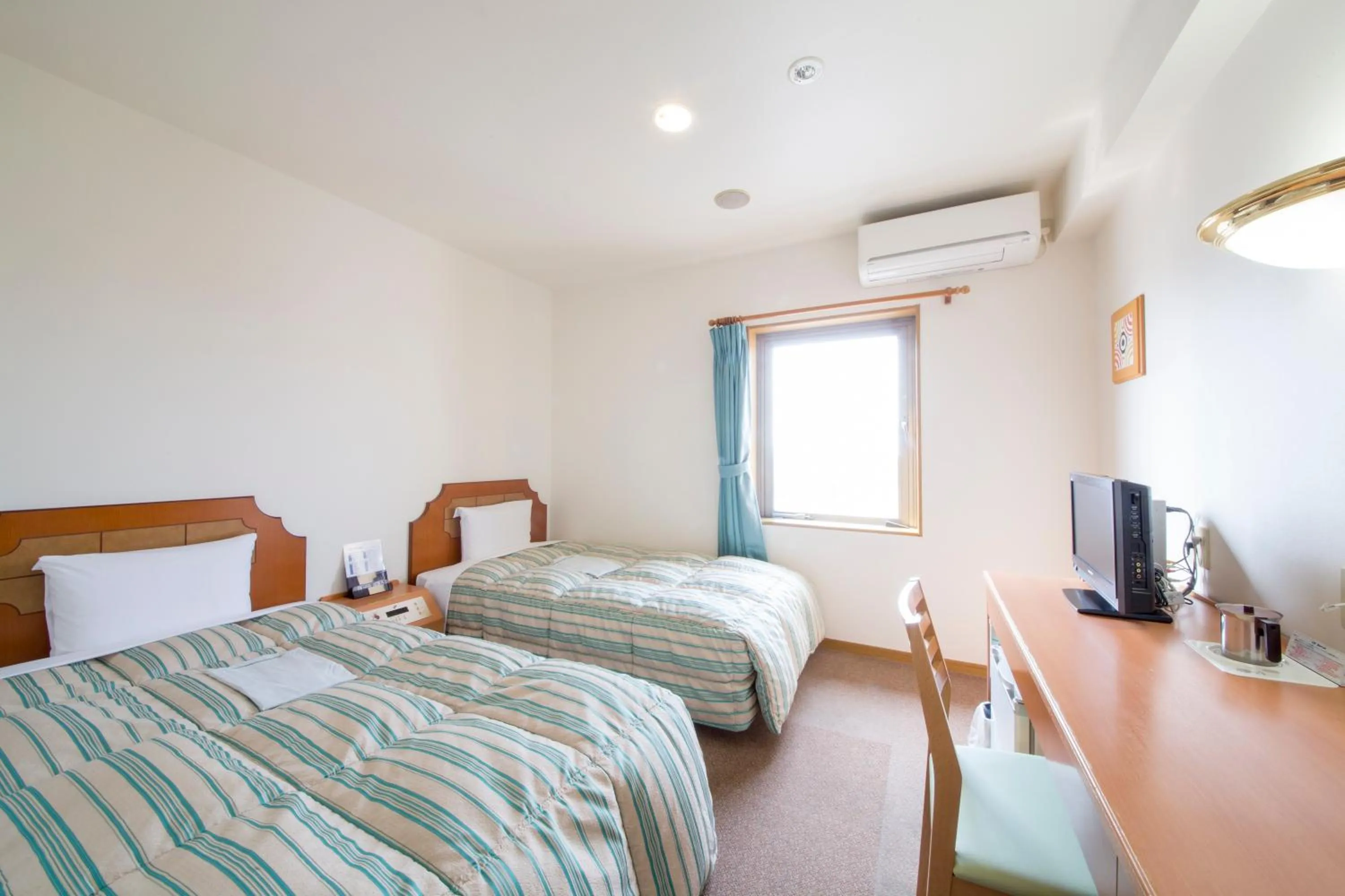 Bed in Hyper Hotel Komatsu