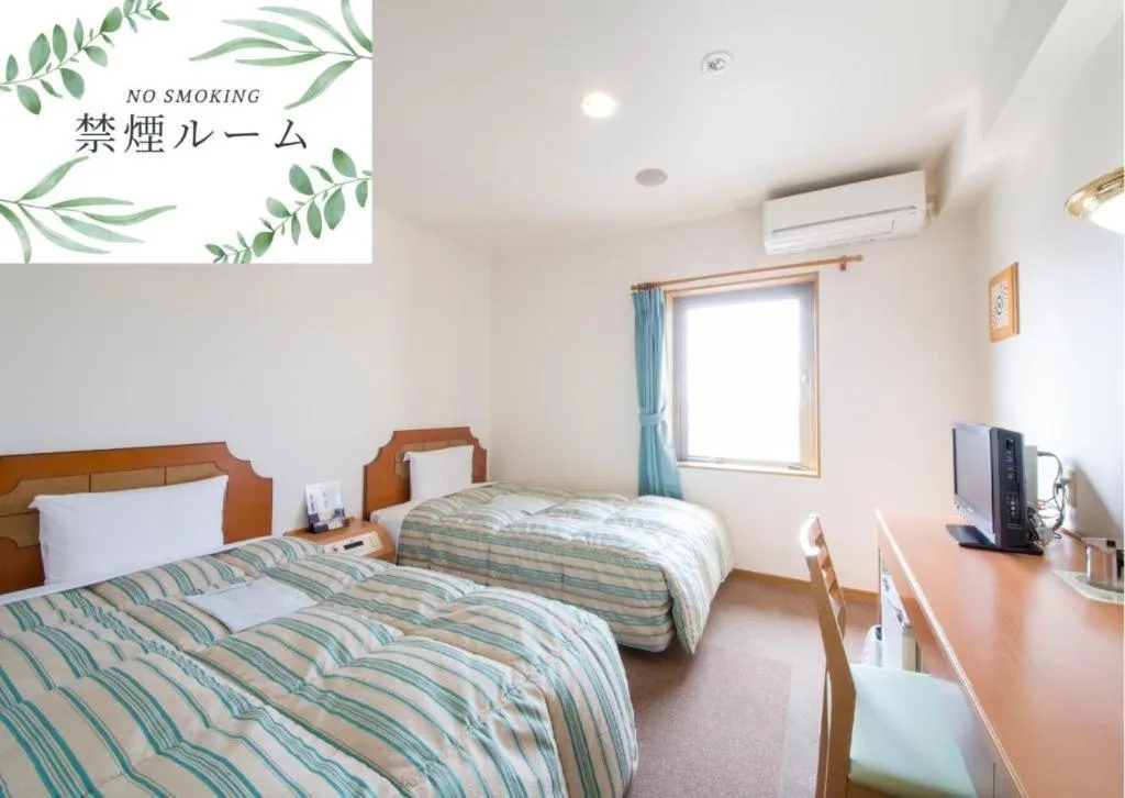 Bed in Hyper Hotel Komatsu