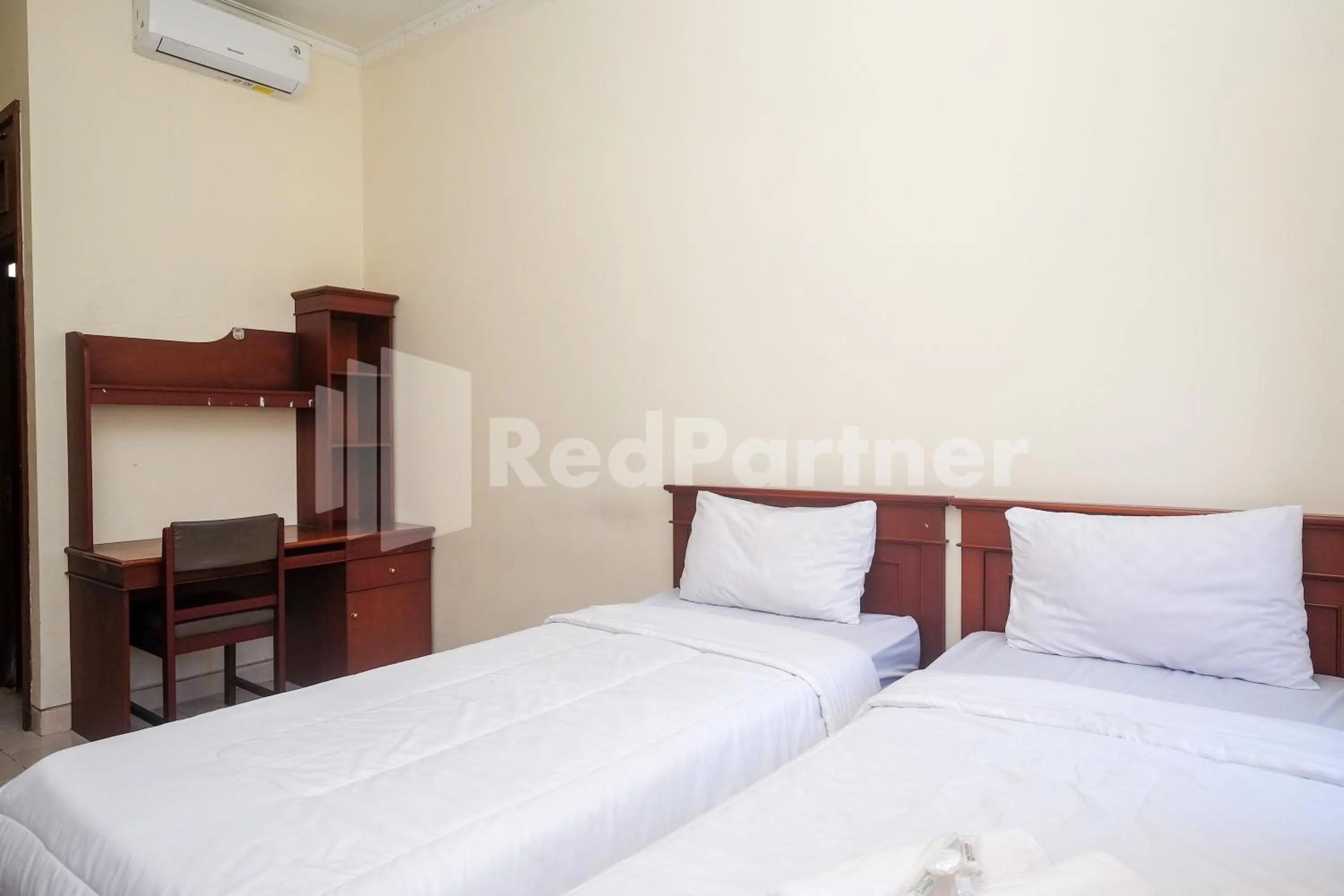 Bed in Griya Fatima Mitra RedDoorz near UGM