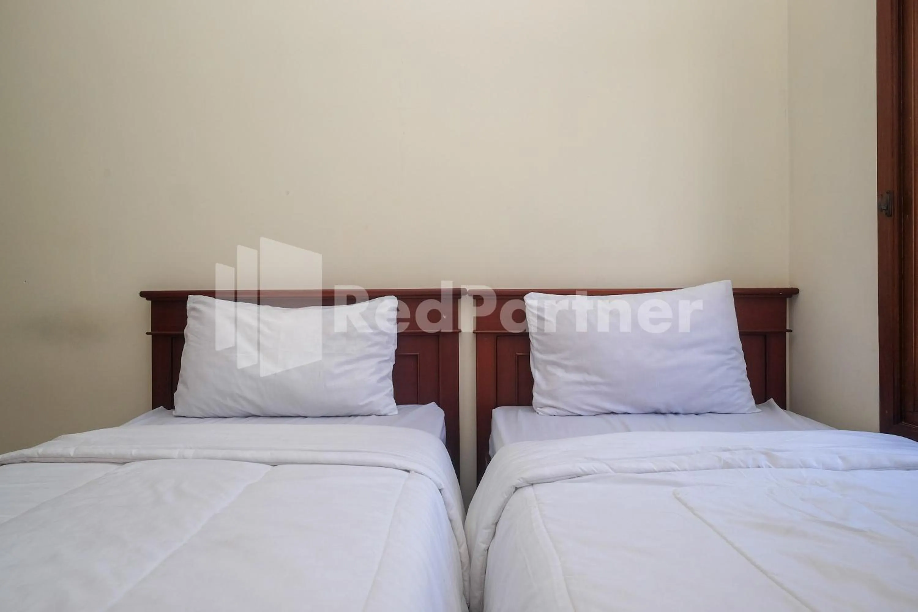 Bed in Griya Fatima Mitra RedDoorz near UGM