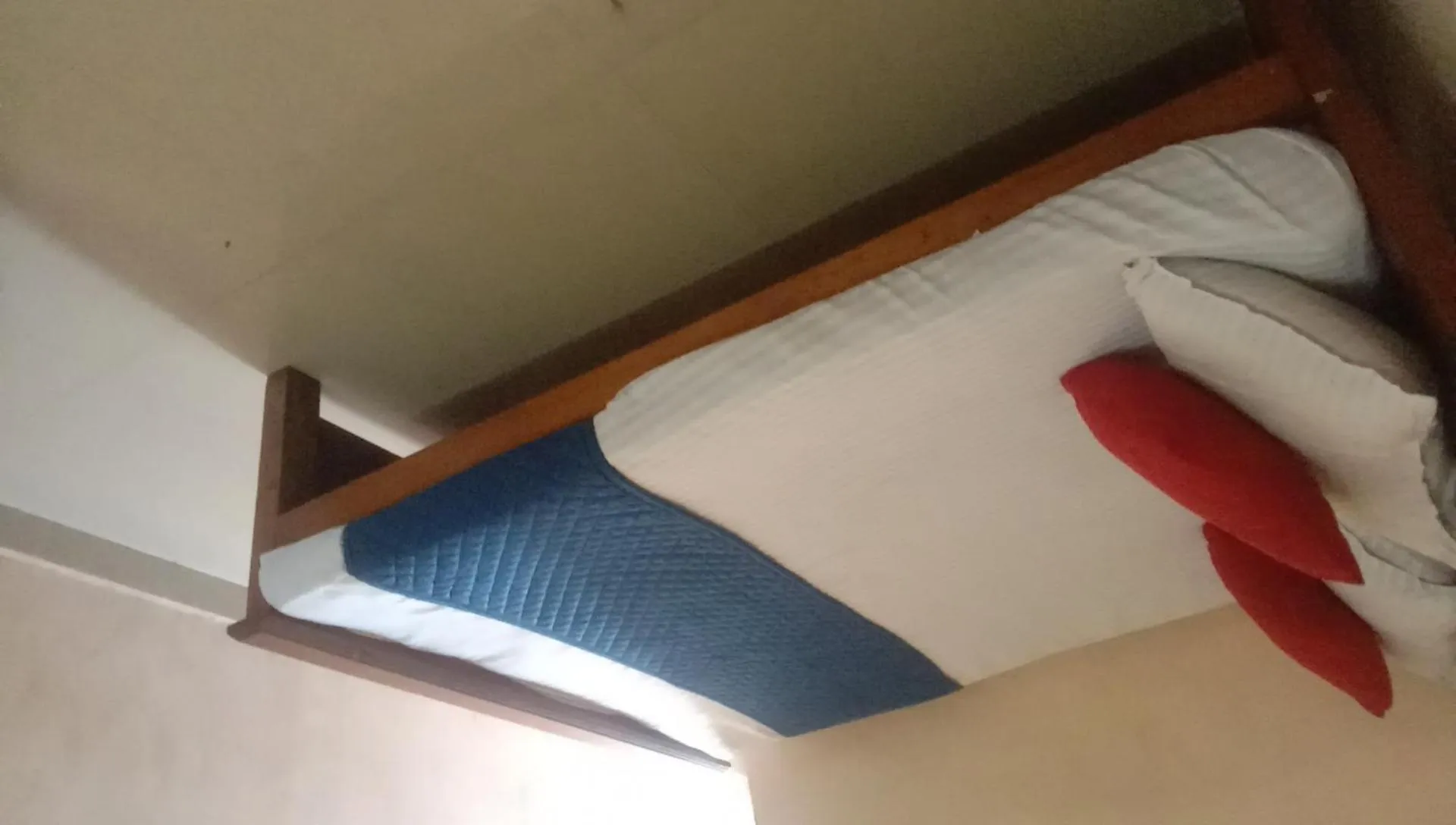 Bed in Sri Krishna Guest House