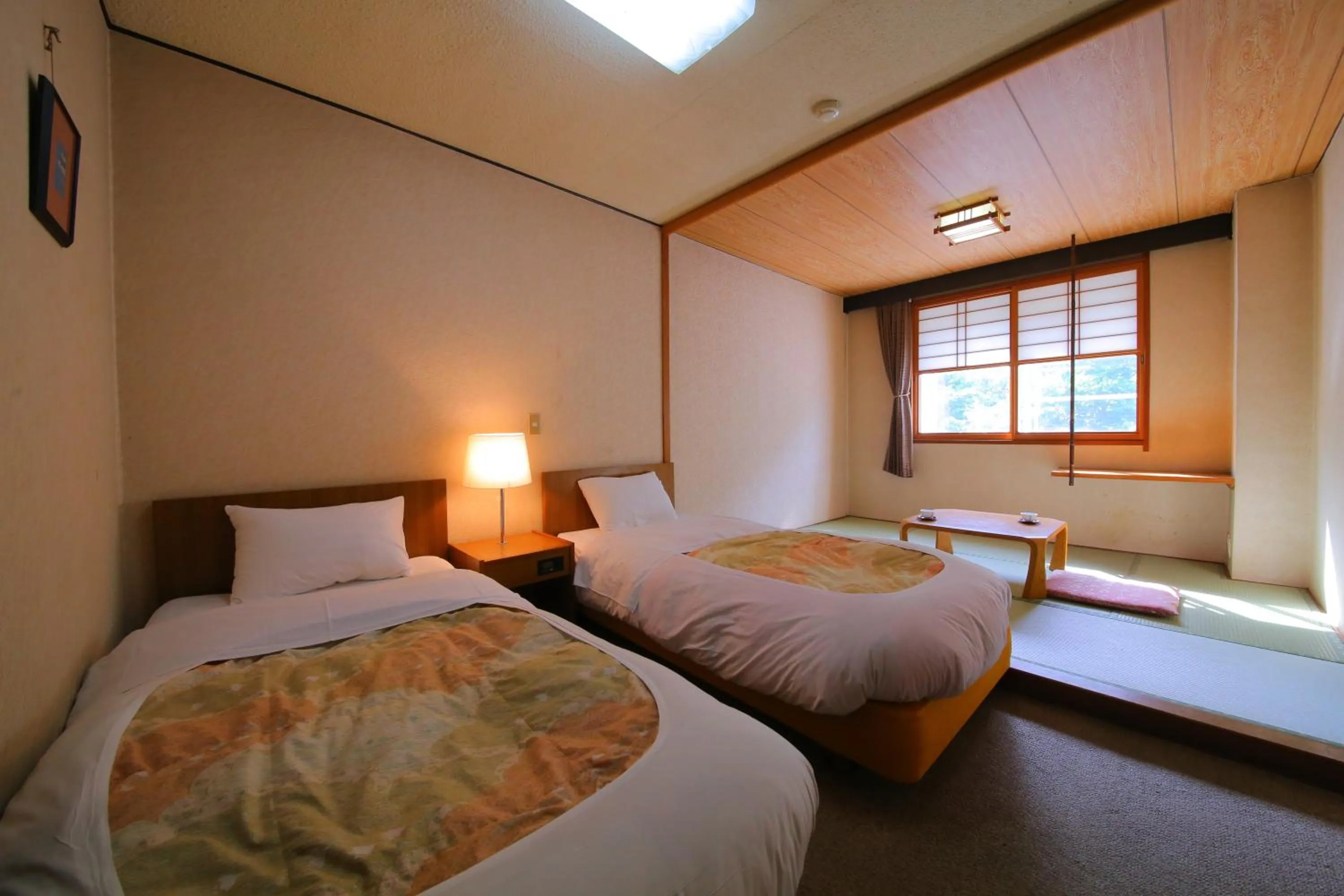 Bed in Lake Side Hotel Minatoya