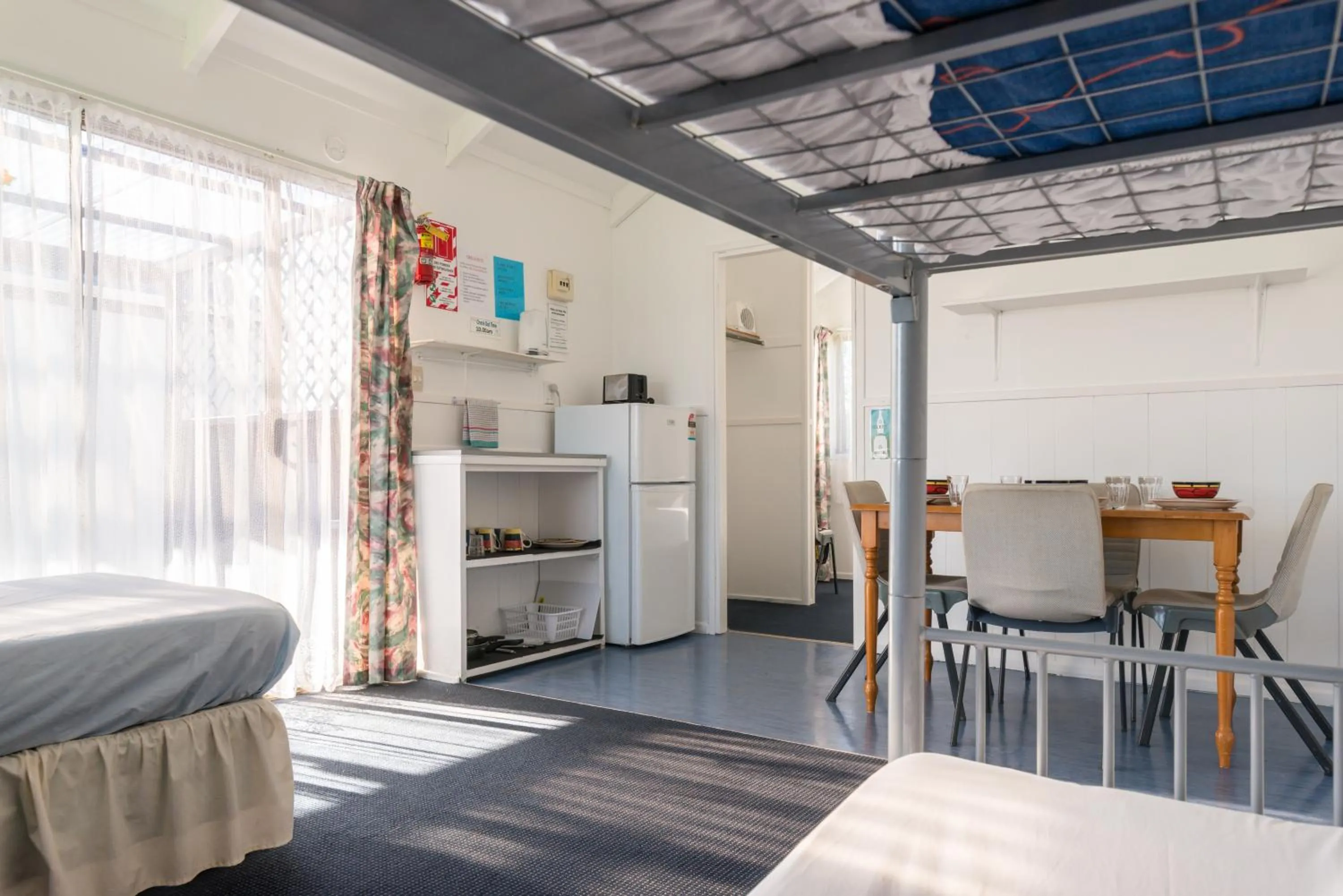 Dining area, Bed in Waitangi Holiday Park