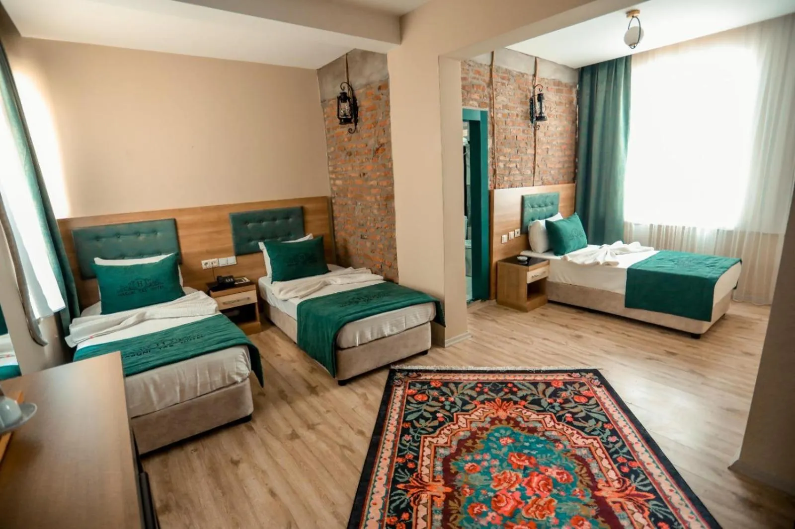 Bed in HASUNİ TAŞ HOTEL