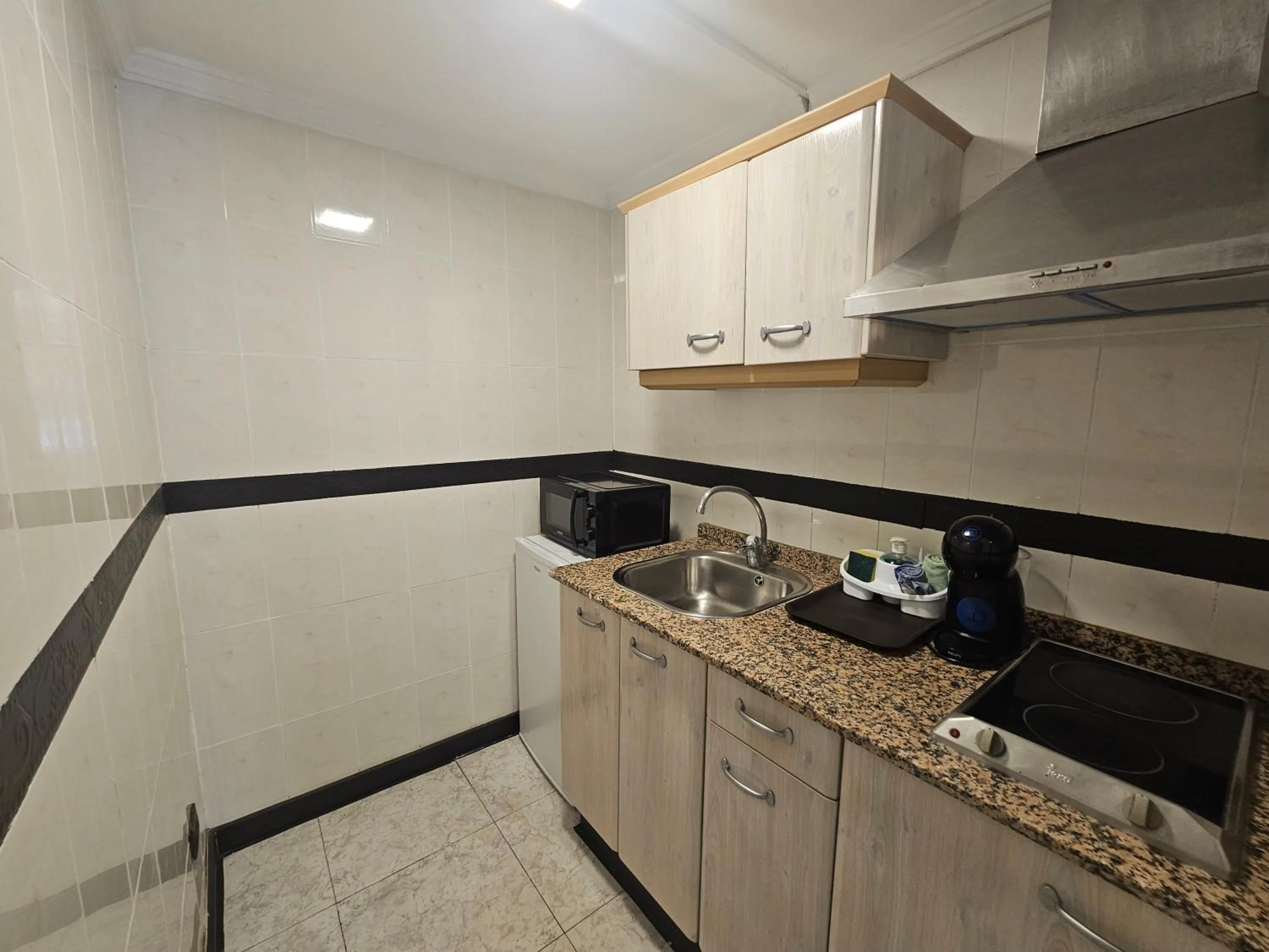Kitchen or kitchenette in Apartamentos Fayna