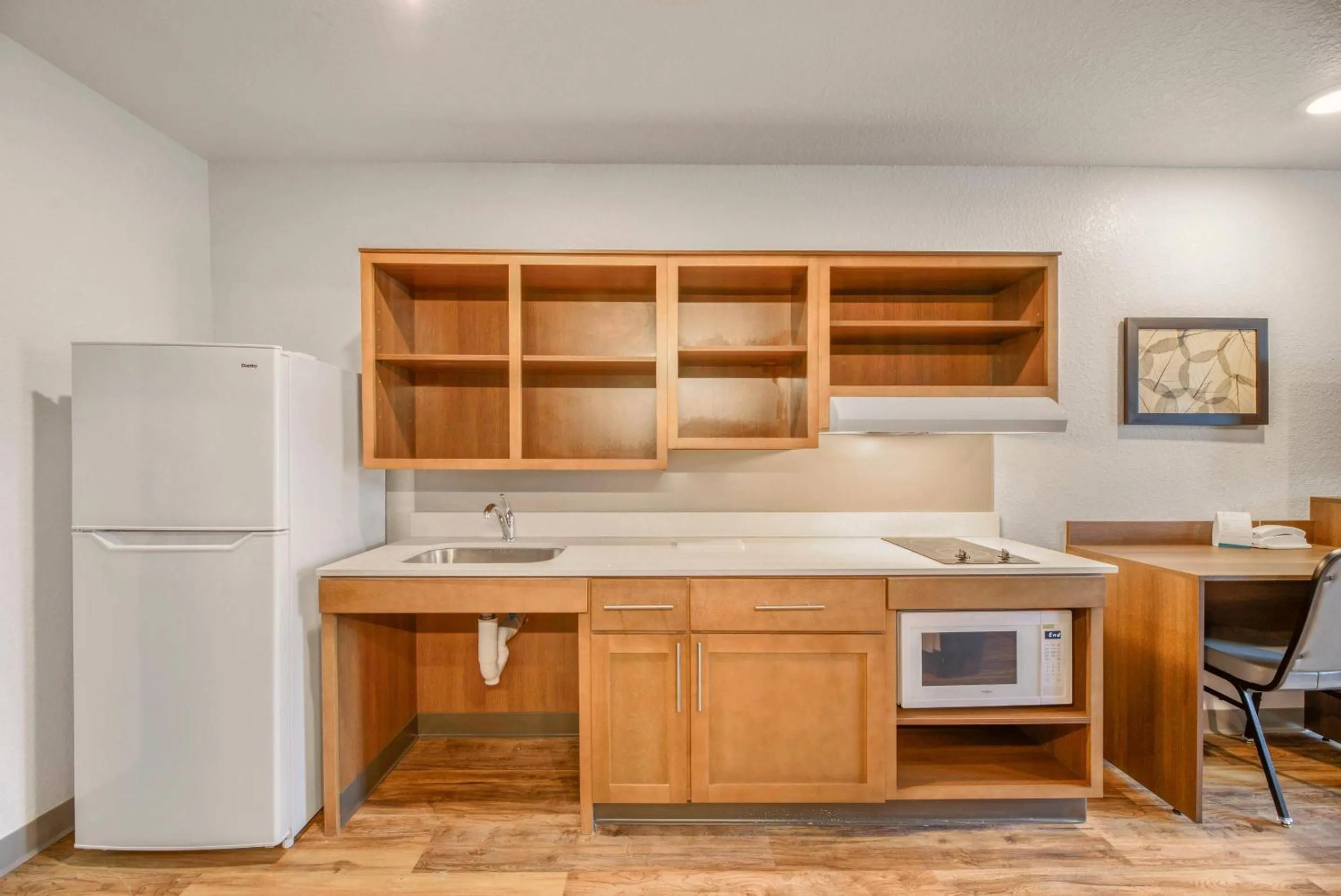 Bedroom in WoodSpring Suites Orlando I-4 & Convention Center