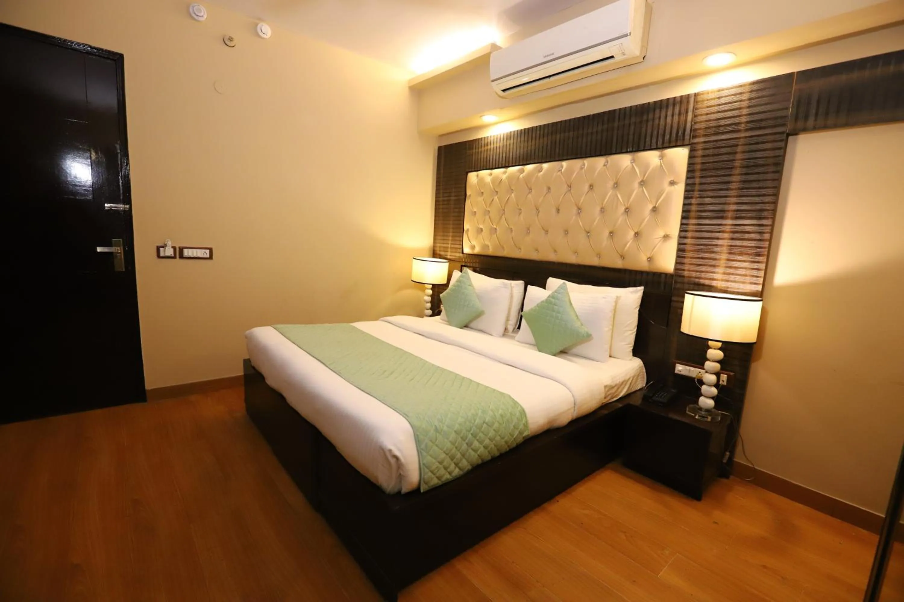 Photo of the whole room, Bed in Hotel Palm Grand Naraina New Delhi - Couple Friendly Local IDs Accepted