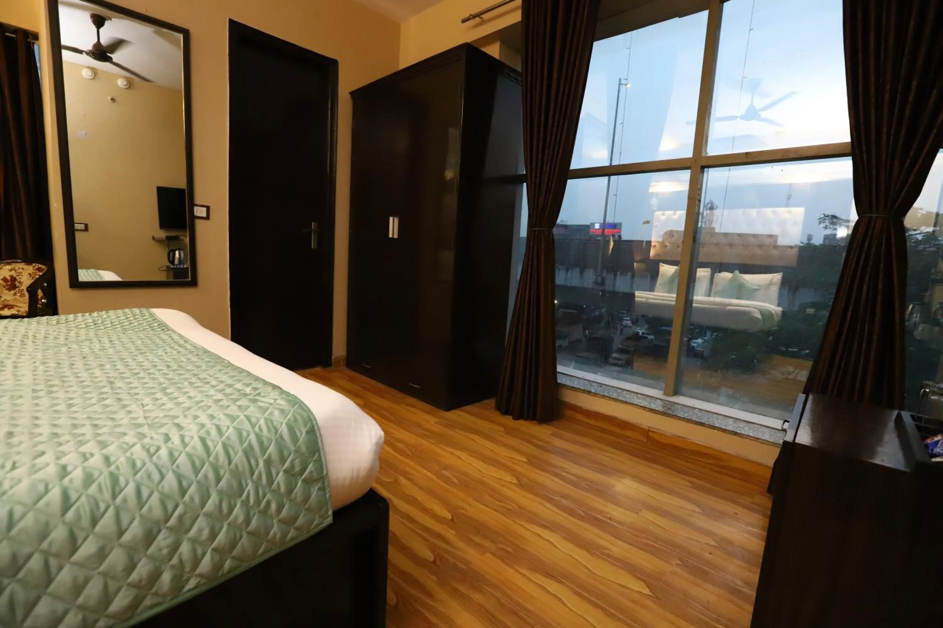 Photo of the whole room, Bed in Hotel Palm Grand Naraina New Delhi - Couple Friendly Local IDs Accepted