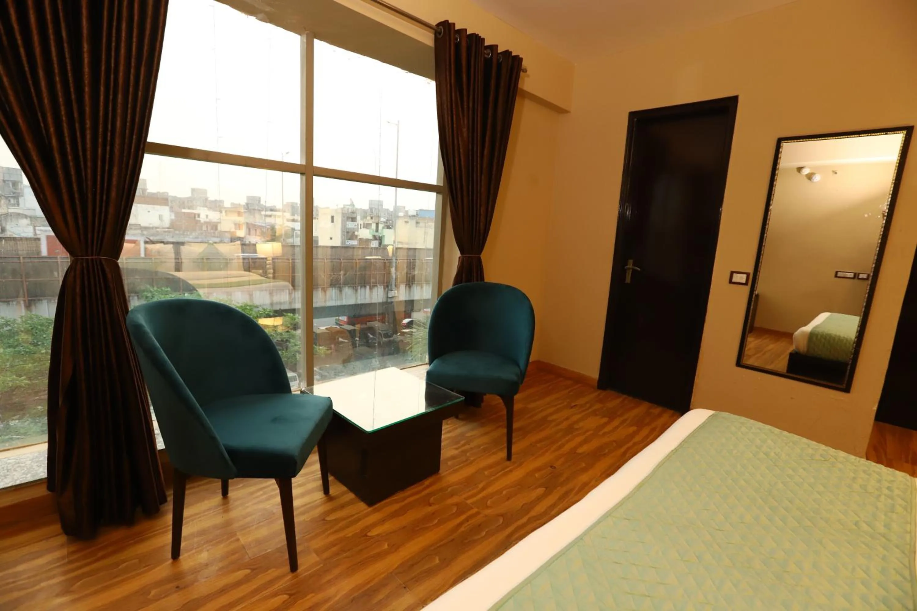 Seating area, Bed in Hotel Palm Grand Naraina New Delhi - Couple Friendly Local IDs Accepted