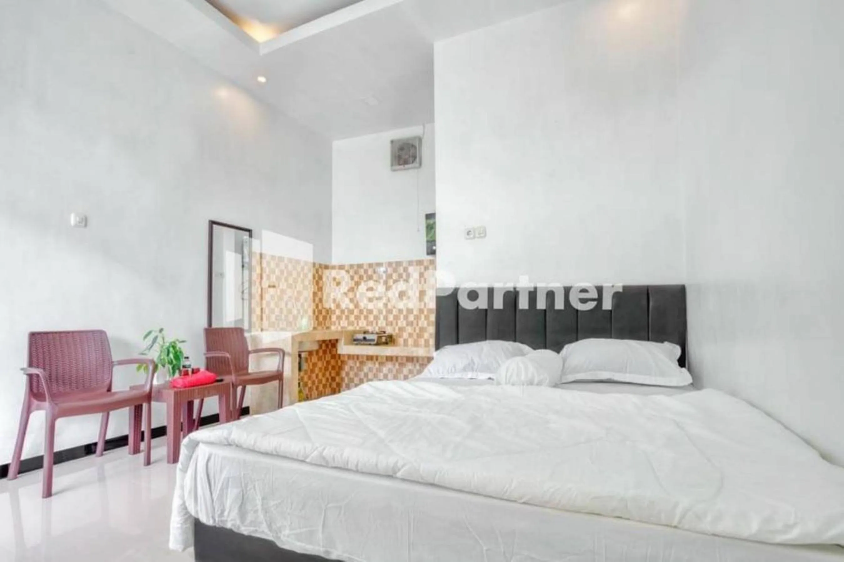 Bed in Griya Rahayu Guesthouse Mitra RedDoorz near Jatim Park 2 Batu