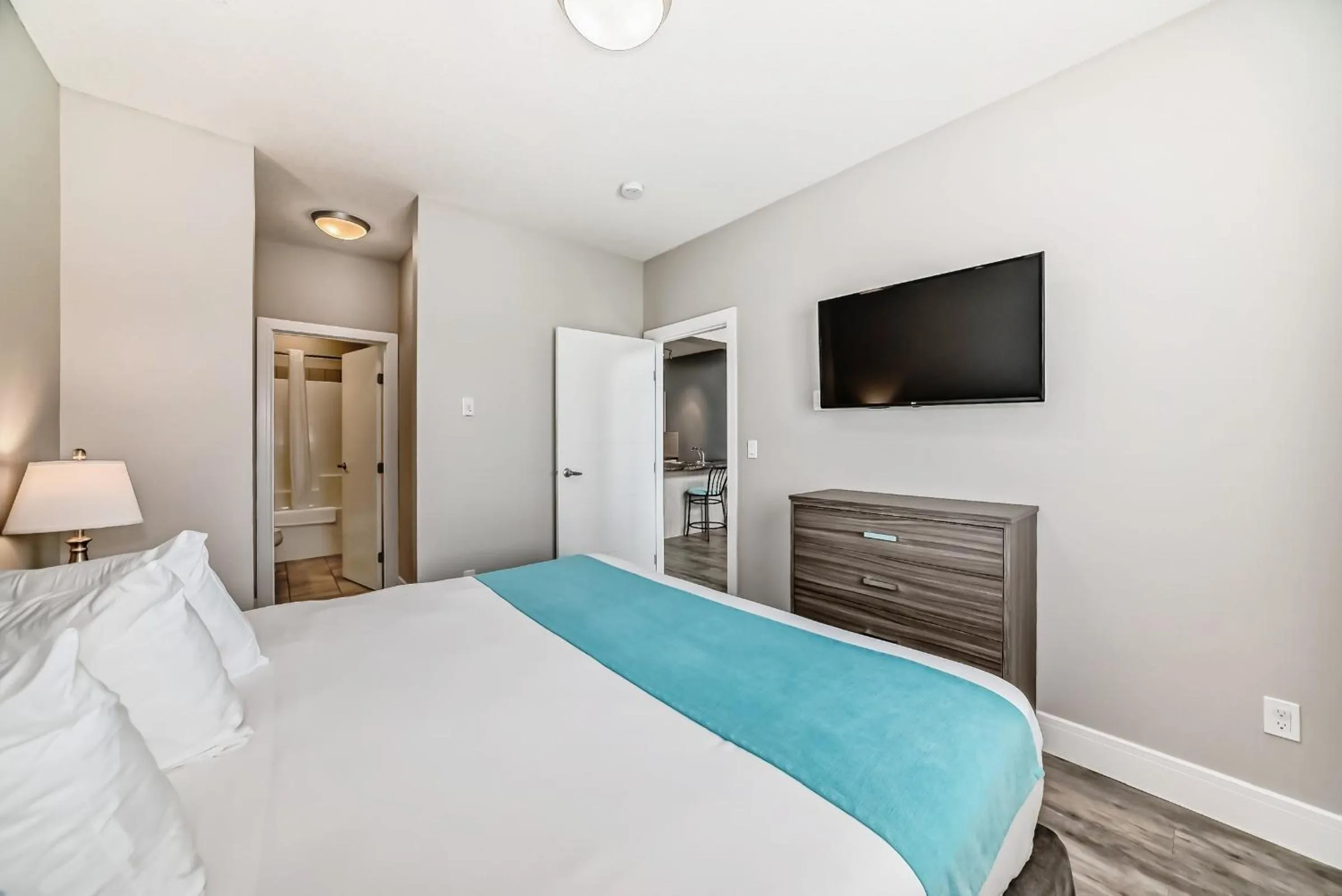 Bed in The Suites, INN Hotels