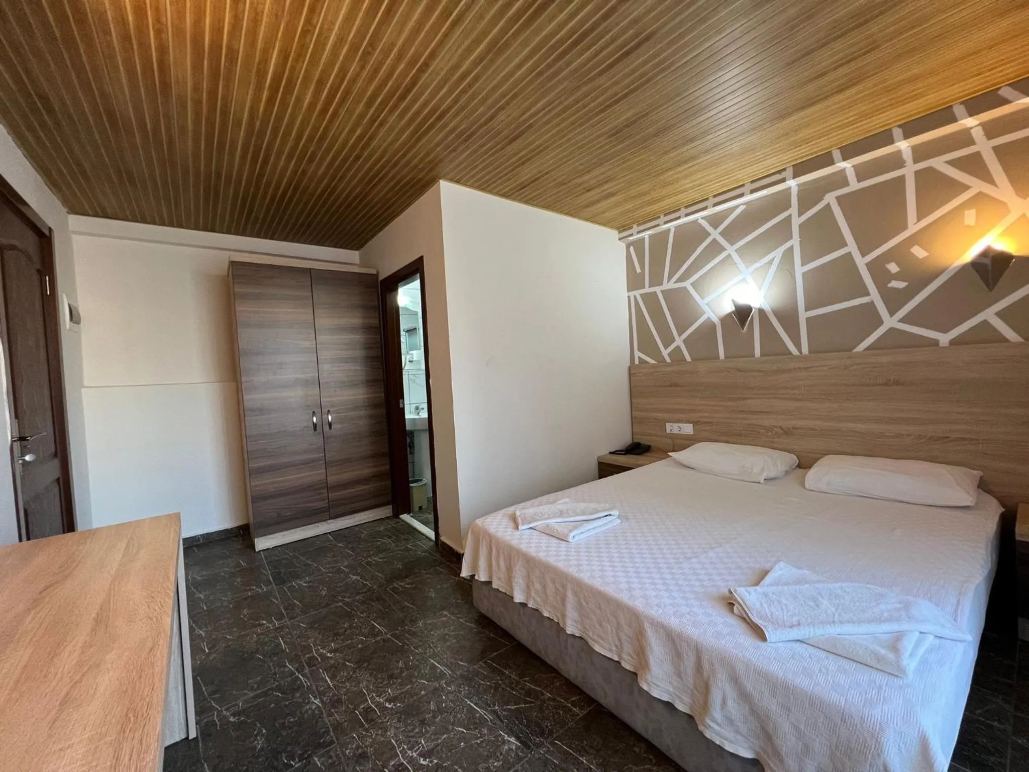 Bed in Mr Crane Hotel