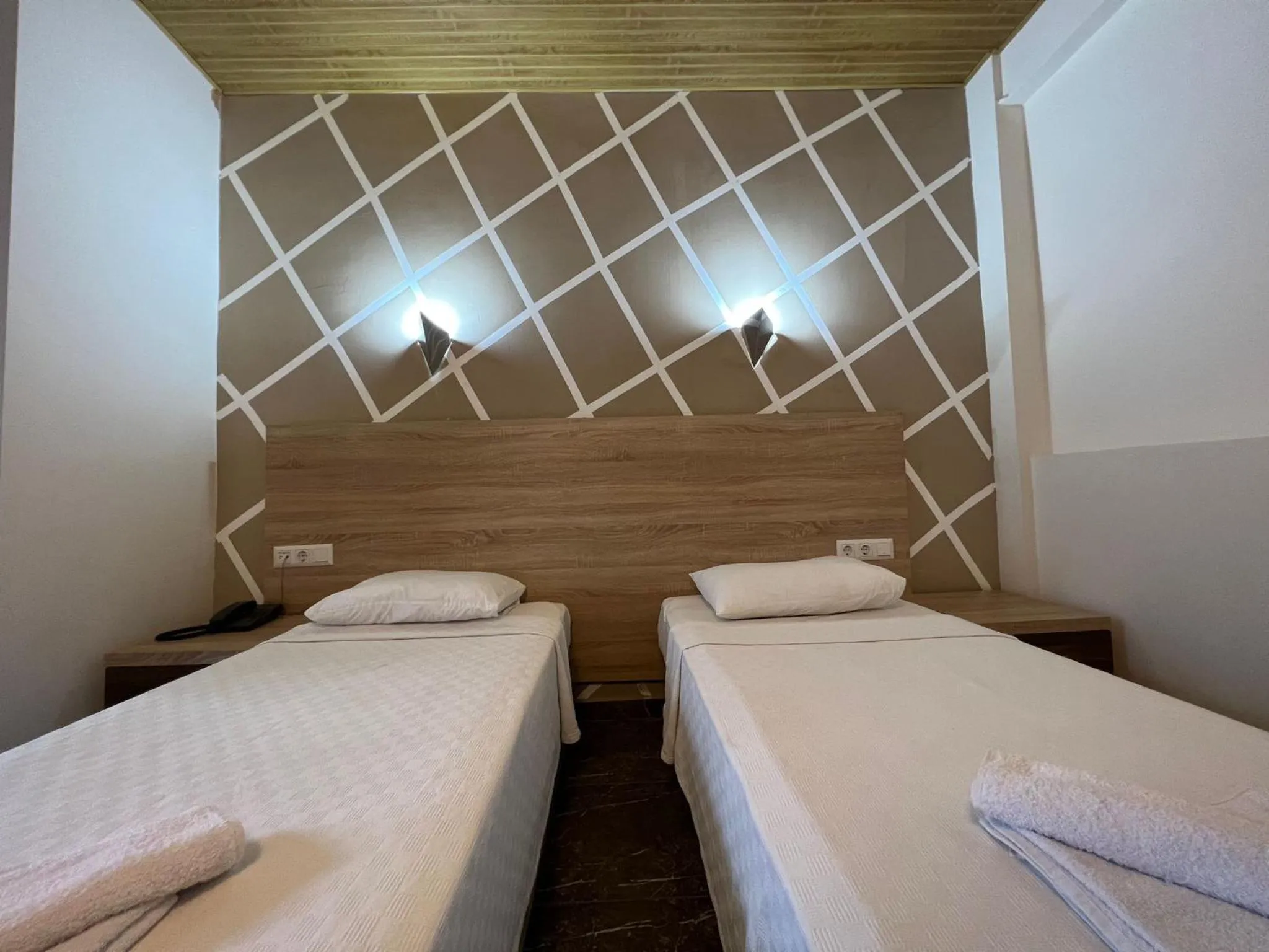 Bed in Mr Crane Hotel