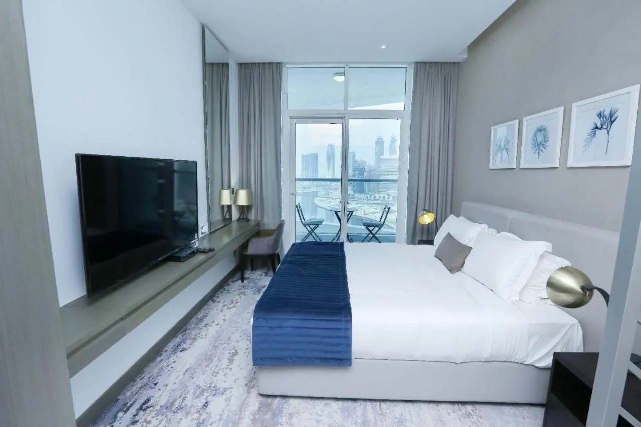 Bed in Damac Maison Prive Deluxe Studio with Water Canal View
