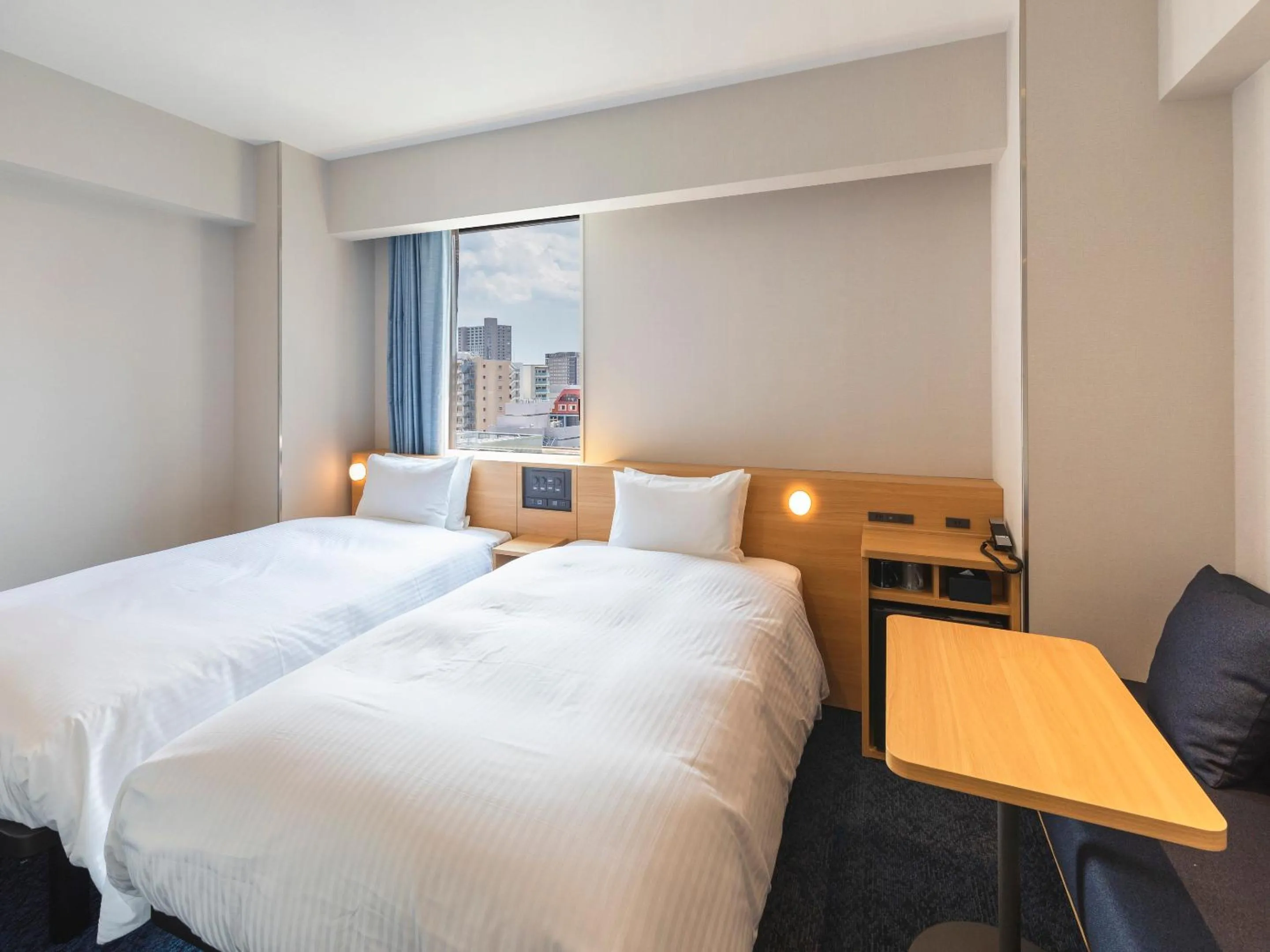 Bed in Sotetsu Fresa Inn Sendai