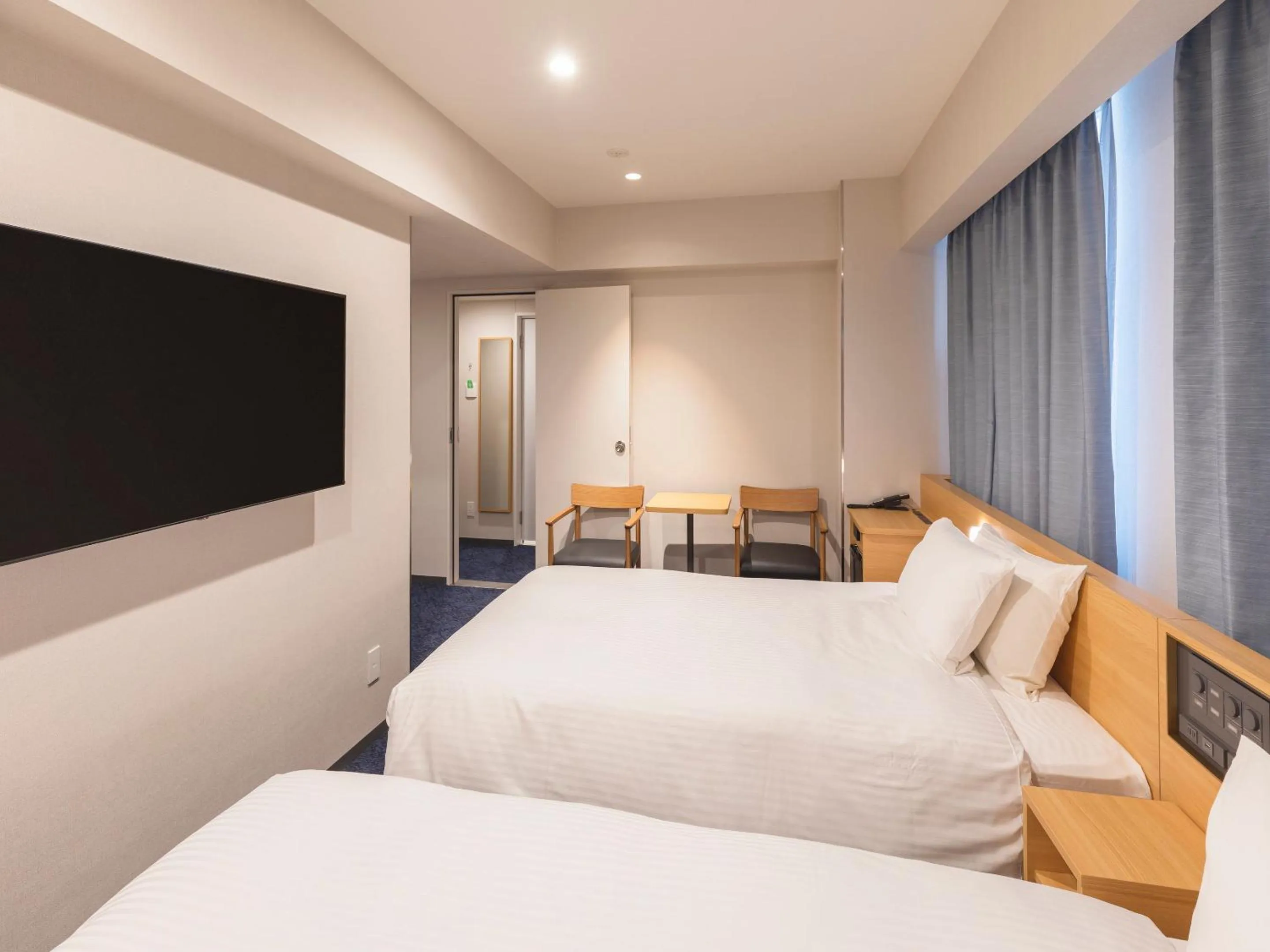 Bed in Sotetsu Fresa Inn Sendai