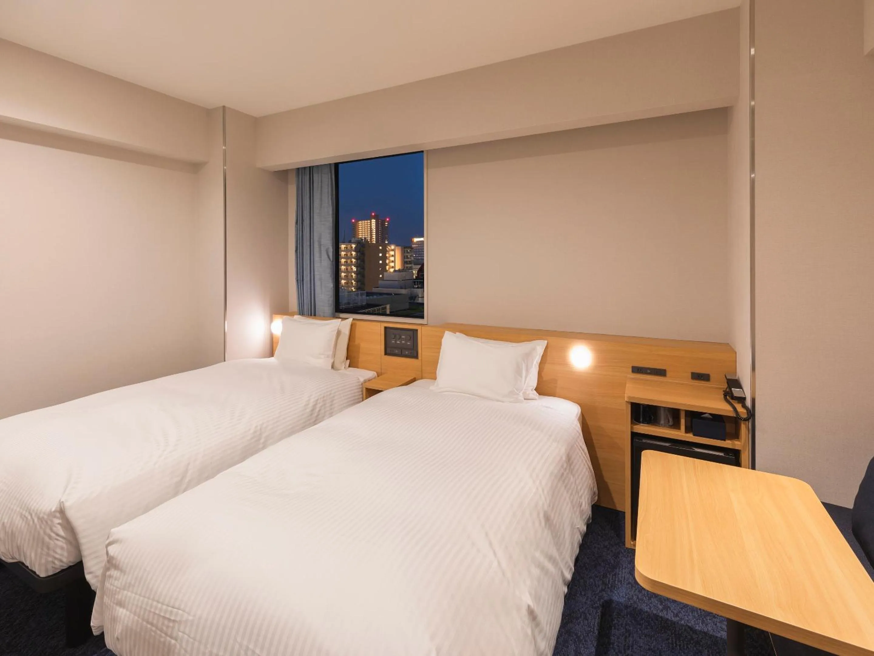 Bed in Sotetsu Fresa Inn Sendai