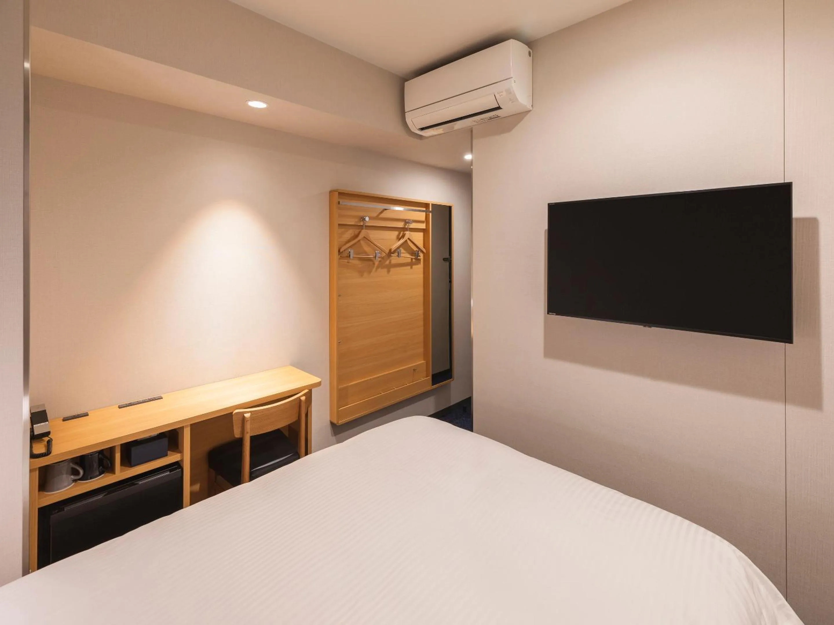 Bed in Sotetsu Fresa Inn Sendai