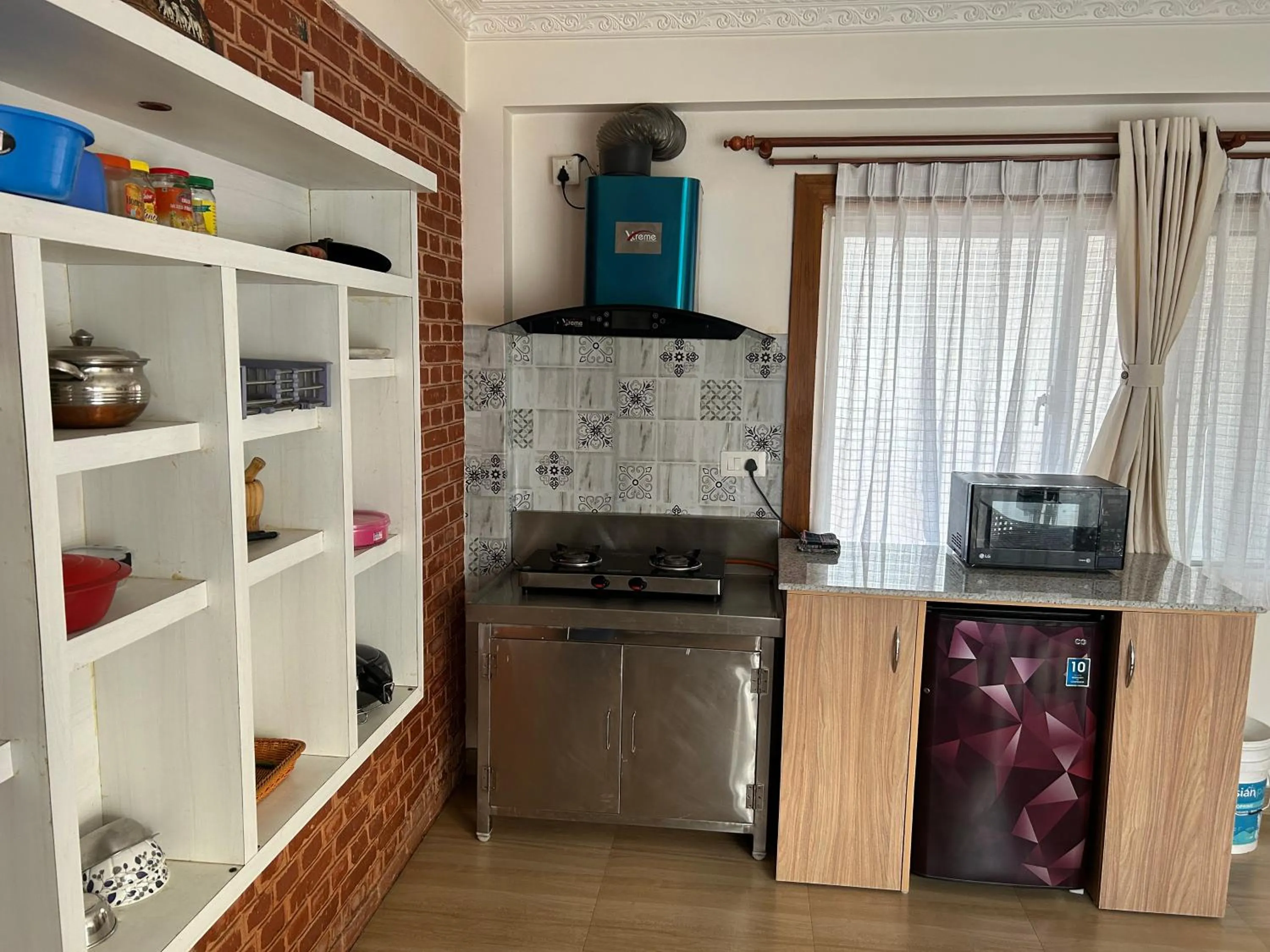 Kitchen or kitchenette in Raniban Suites - Apartment Home