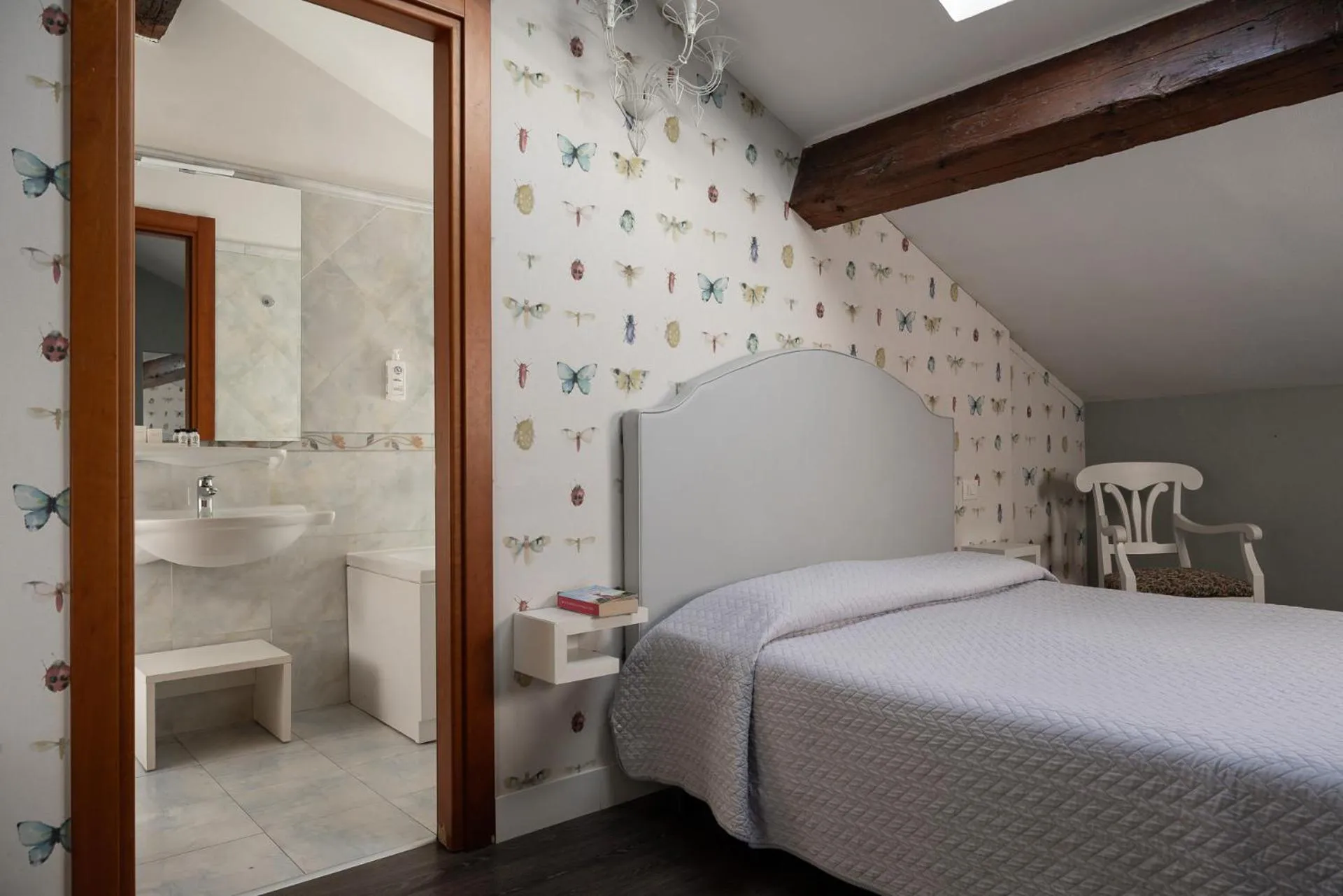 Bed in Maxxim Hotel & Loft