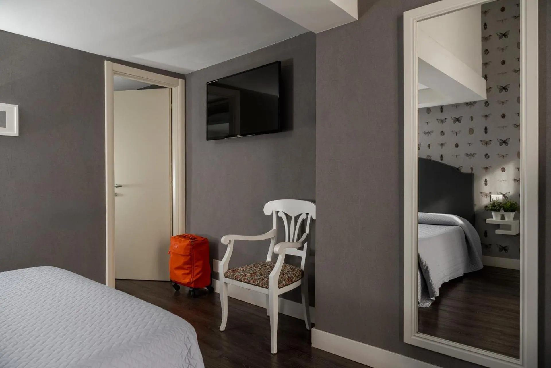 Bed in Maxxim Hotel & Loft