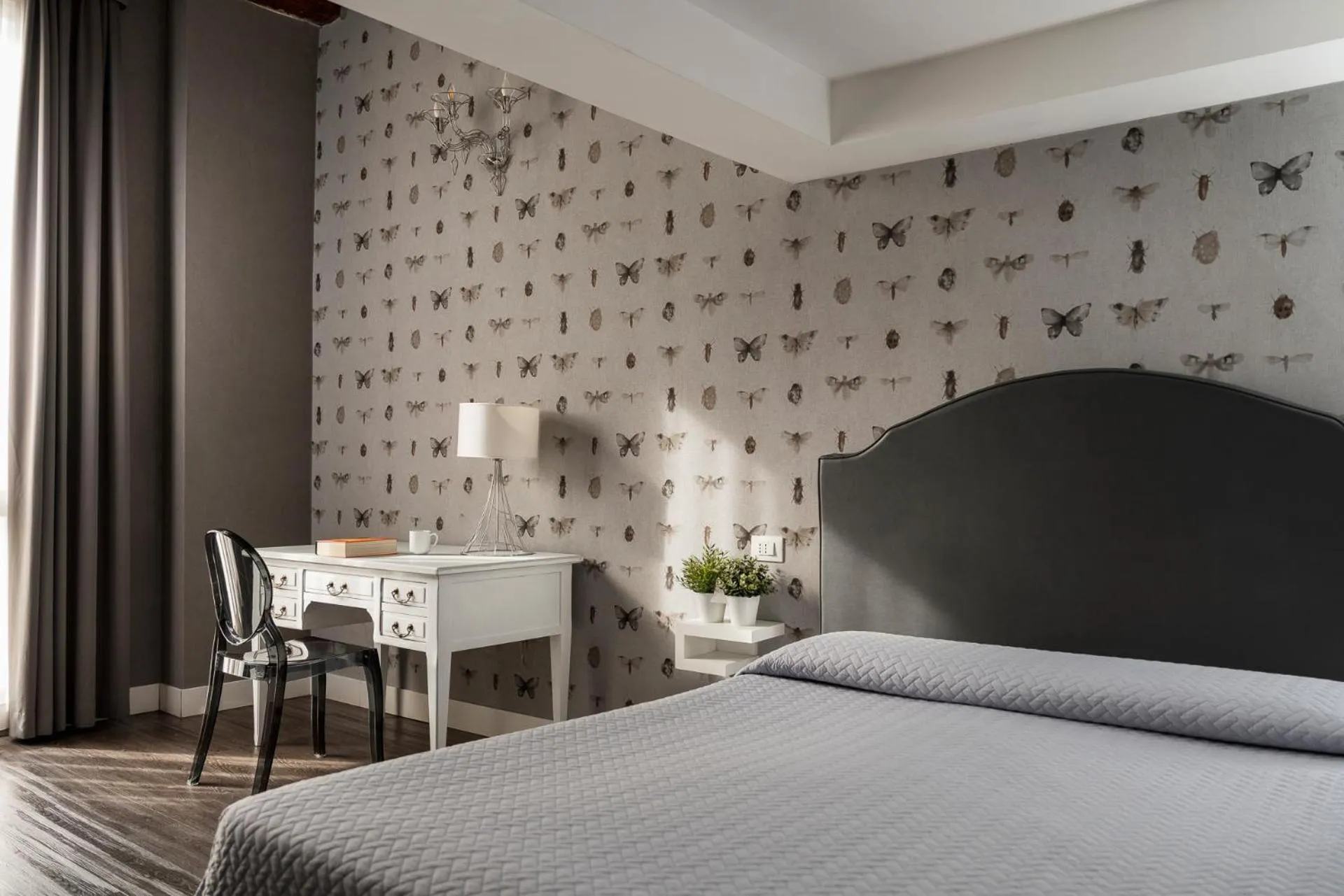 Bed in Maxxim Hotel & Loft