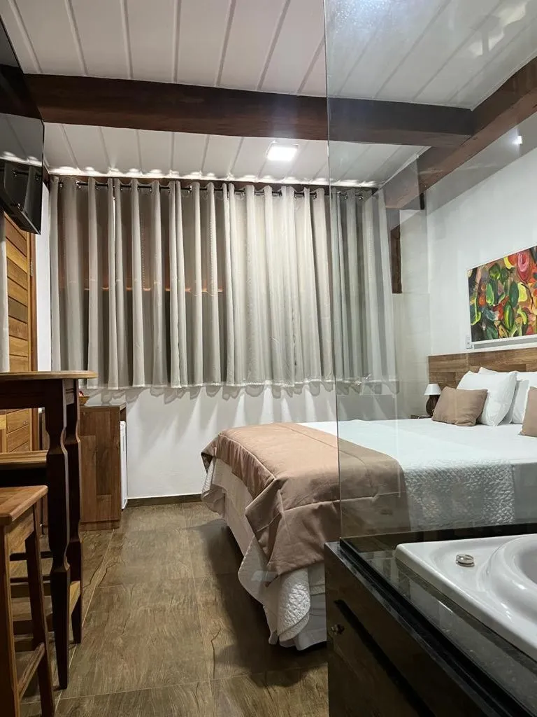 Bed in Pousada Mar Mineiro Macacos