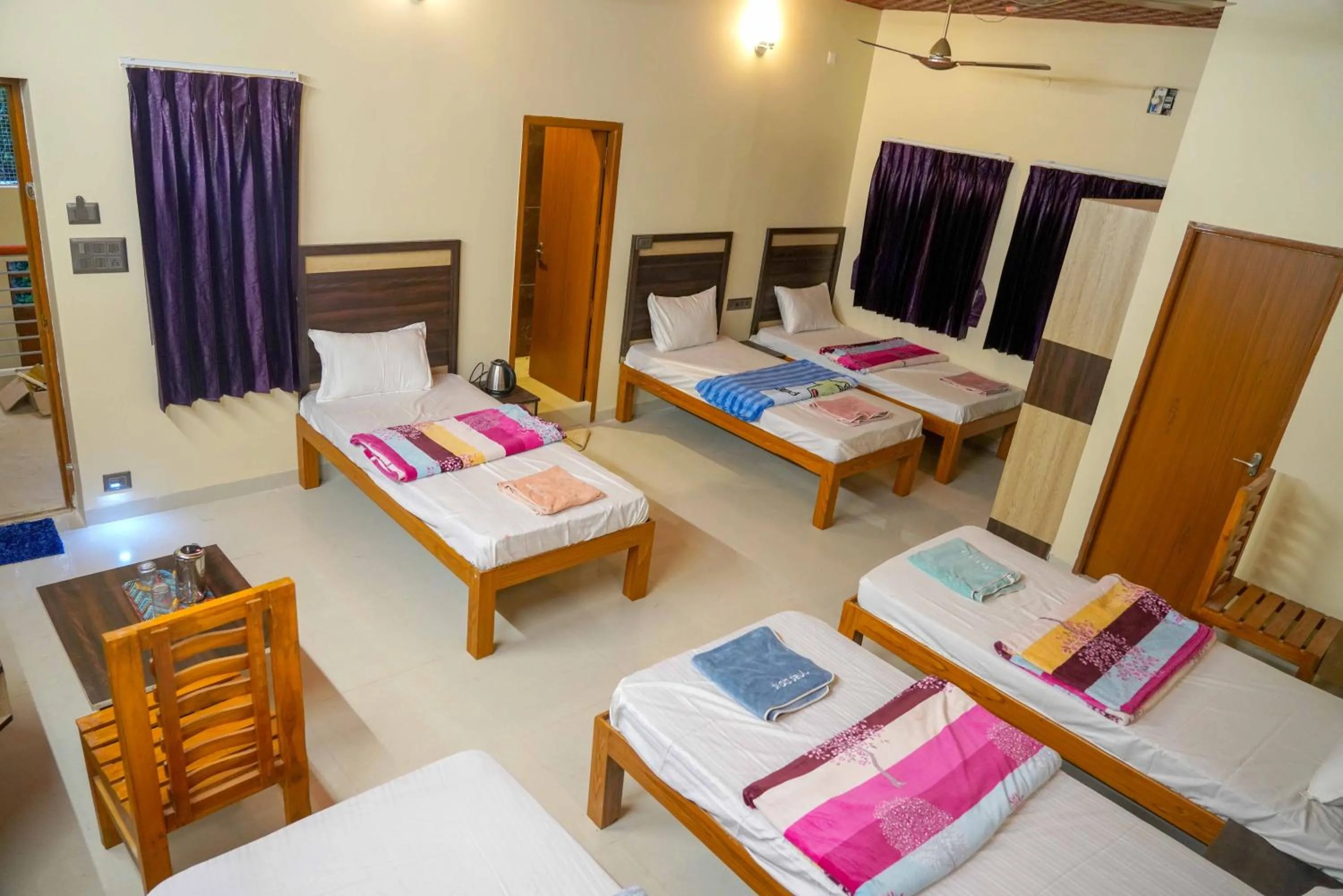Bed in Bhavan Resorts
