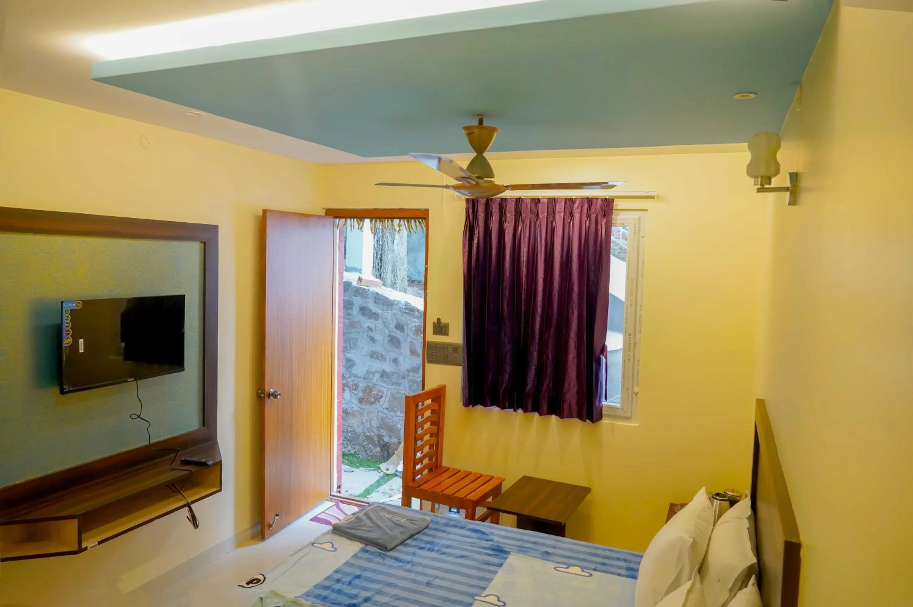 Bed in Bhavan Resorts