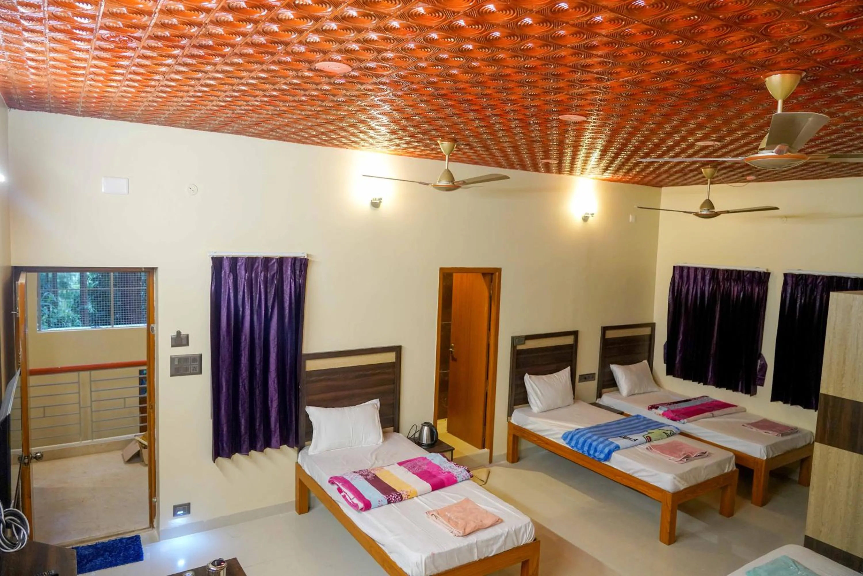 Bed in Bhavan Resorts