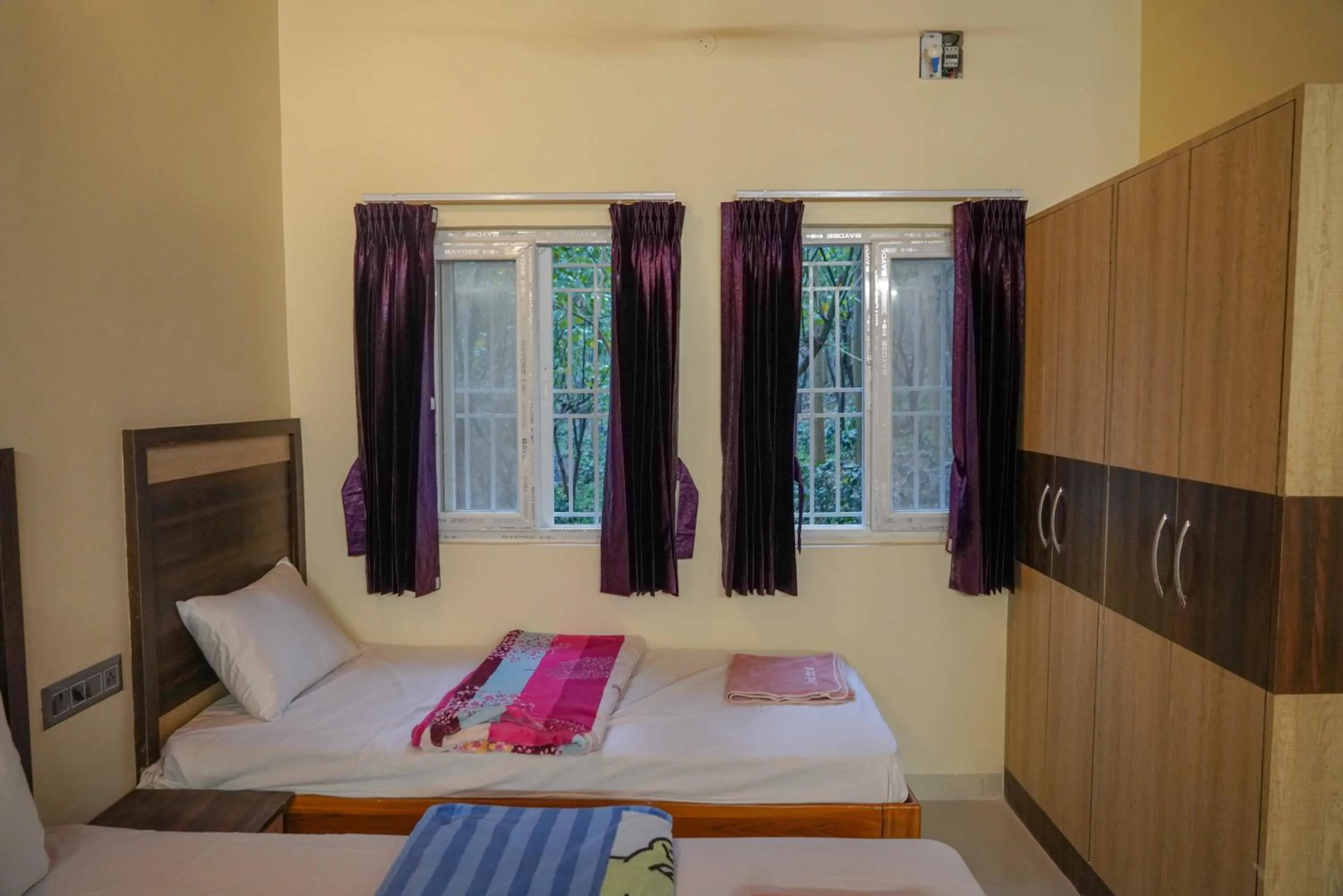 Bed in Bhavan Resorts