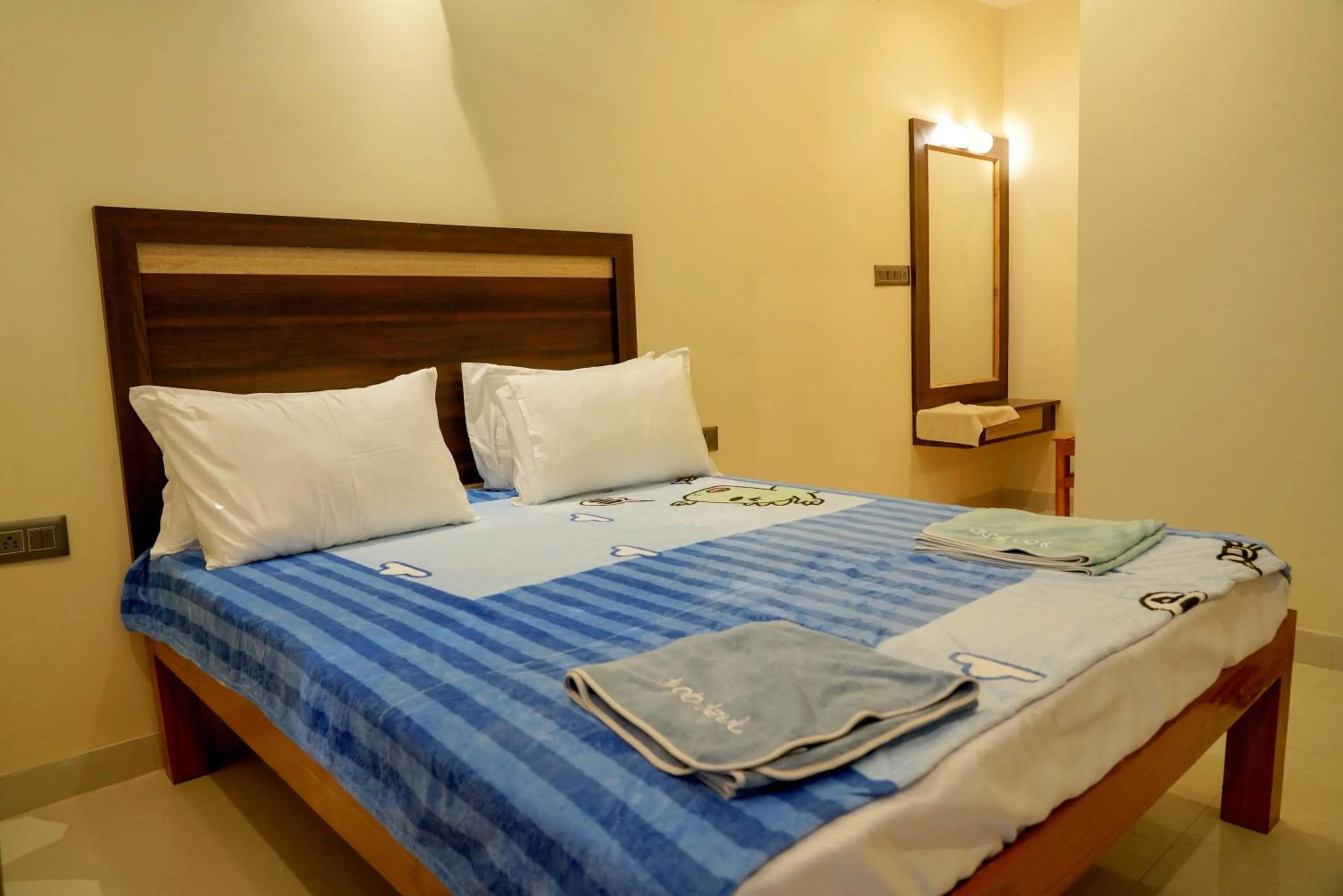 Bed in Bhavan Resorts