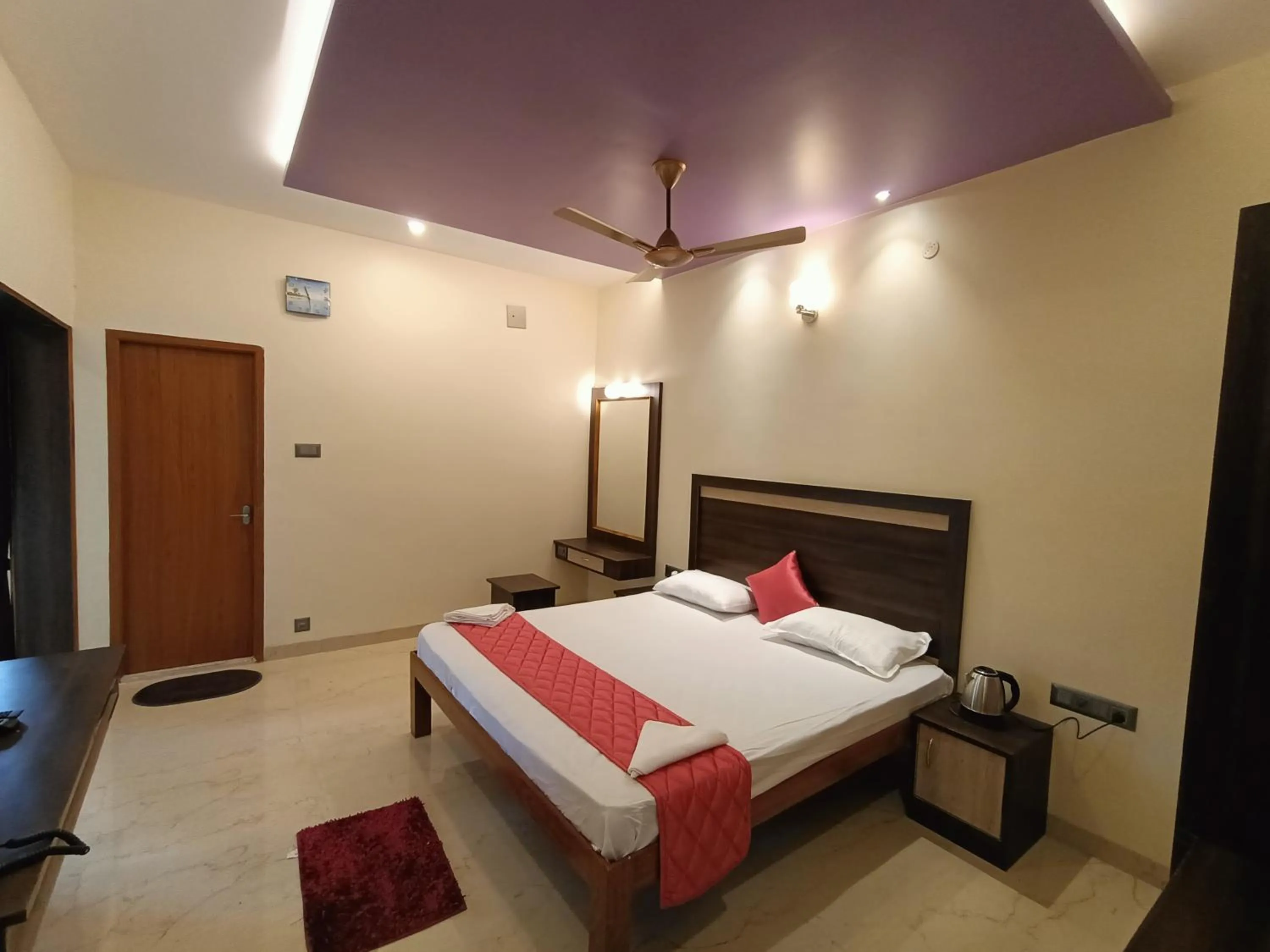 Bed in Bhavan Resorts