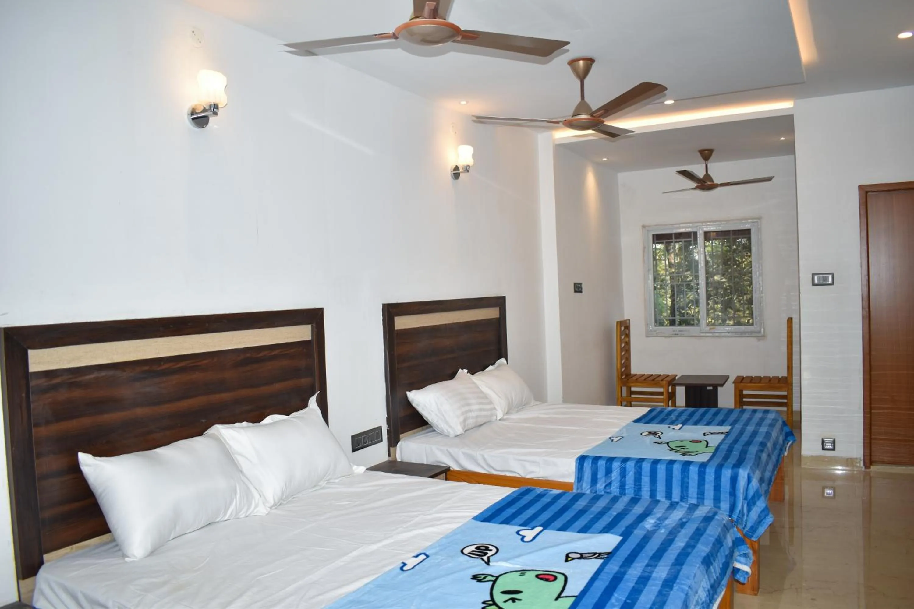 Bed in Bhavan Resorts