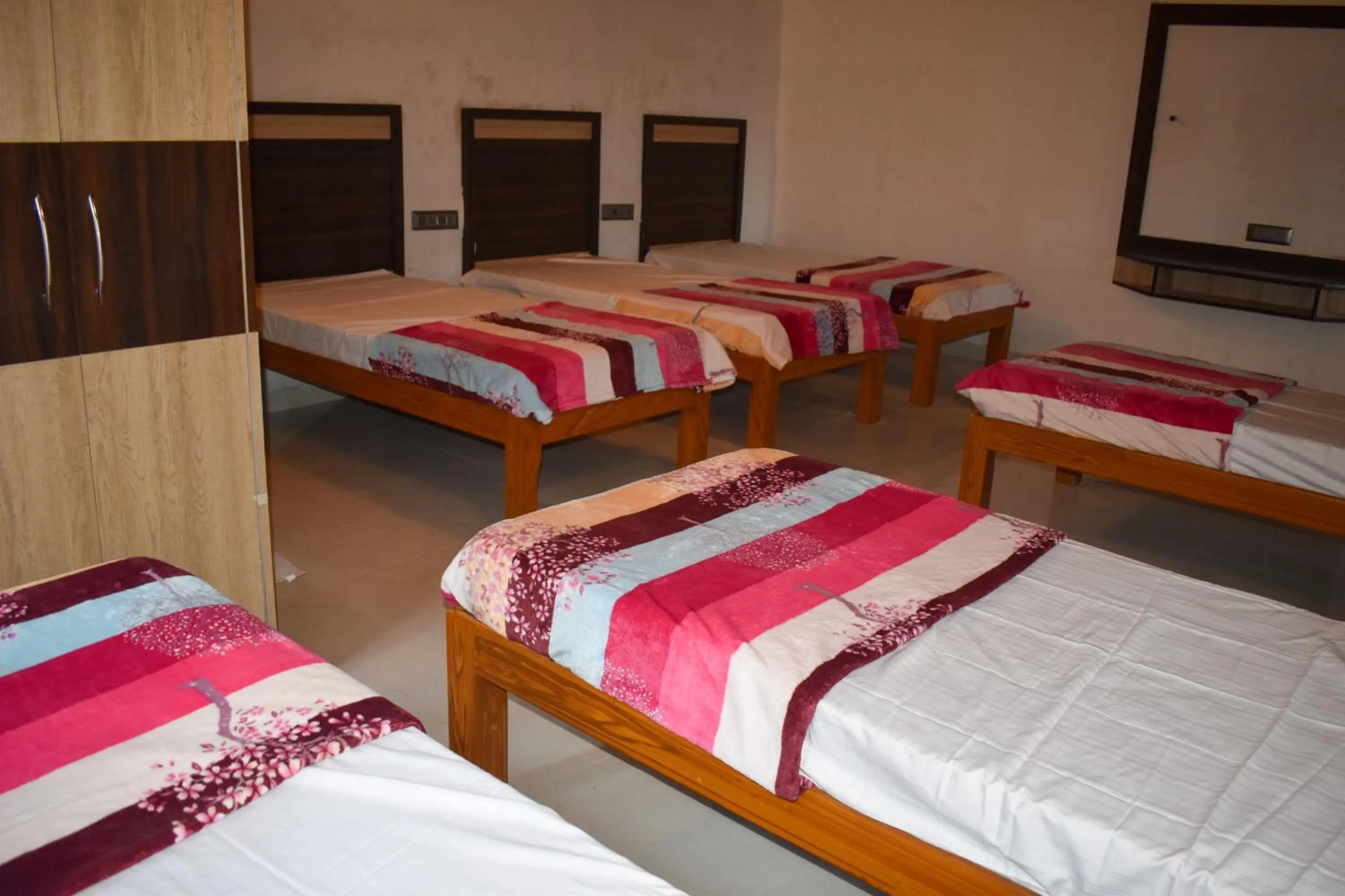 Bed in Bhavan Resorts