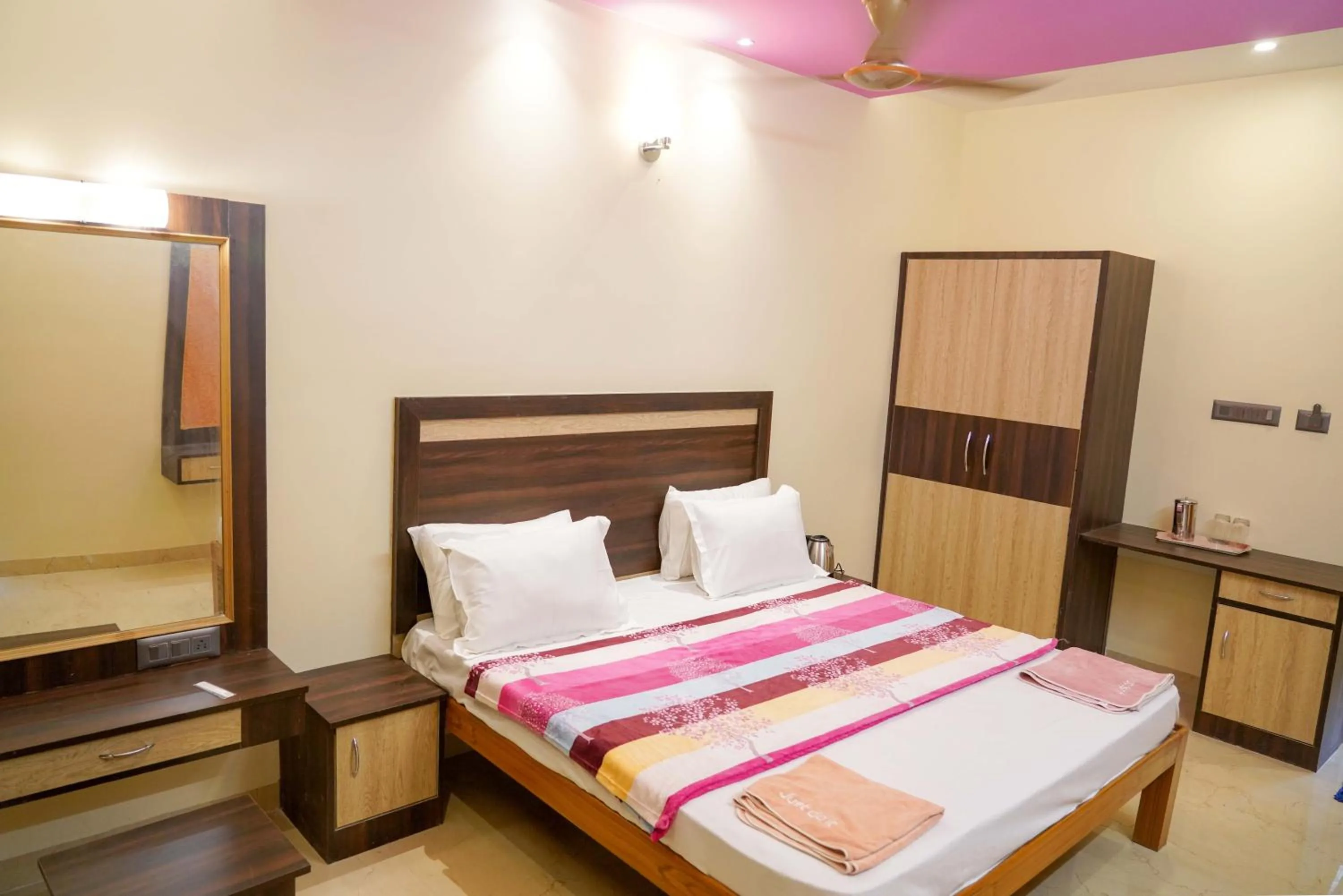 Bed in Bhavan Resorts