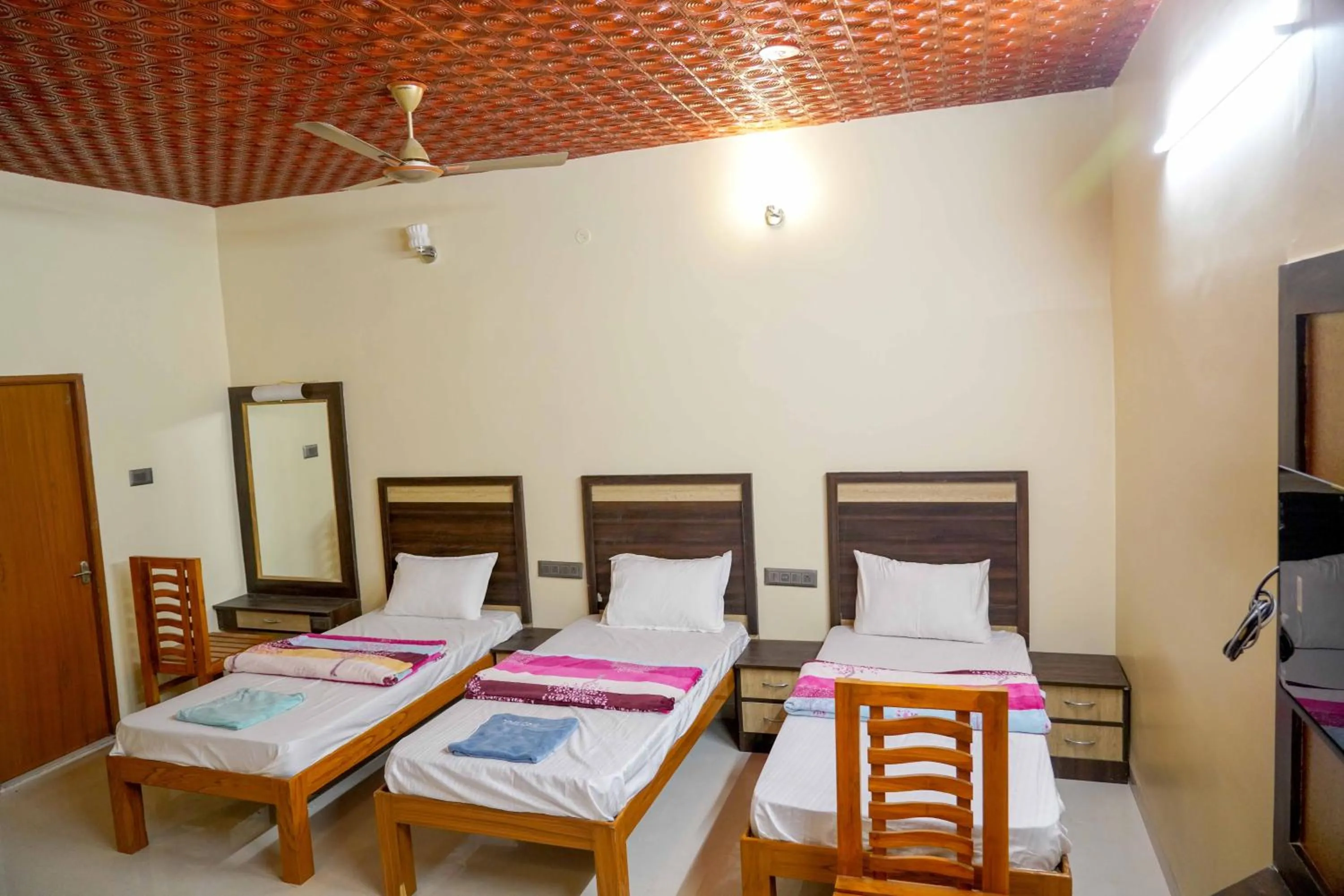 Bed in Bhavan Resorts