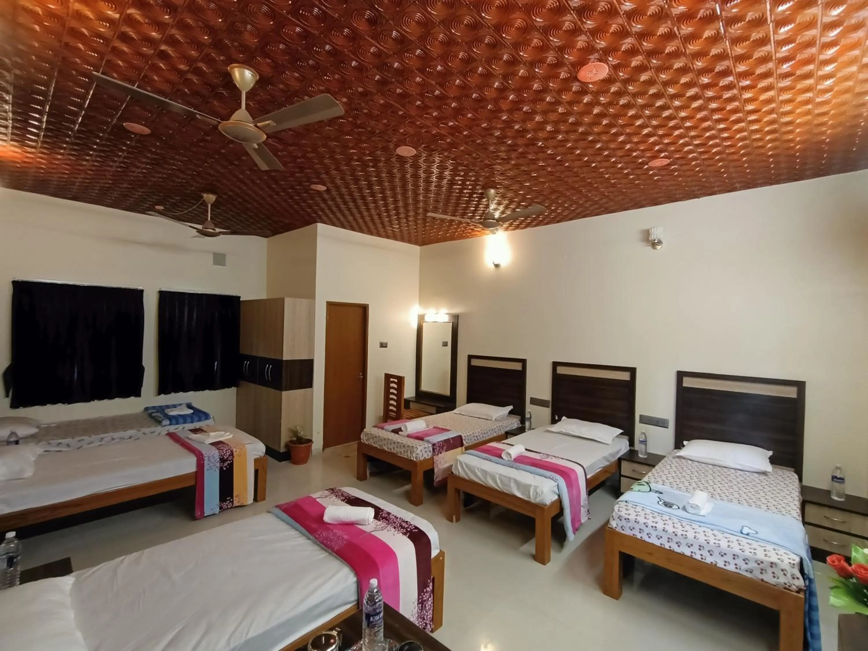 Bed in Bhavan Resorts