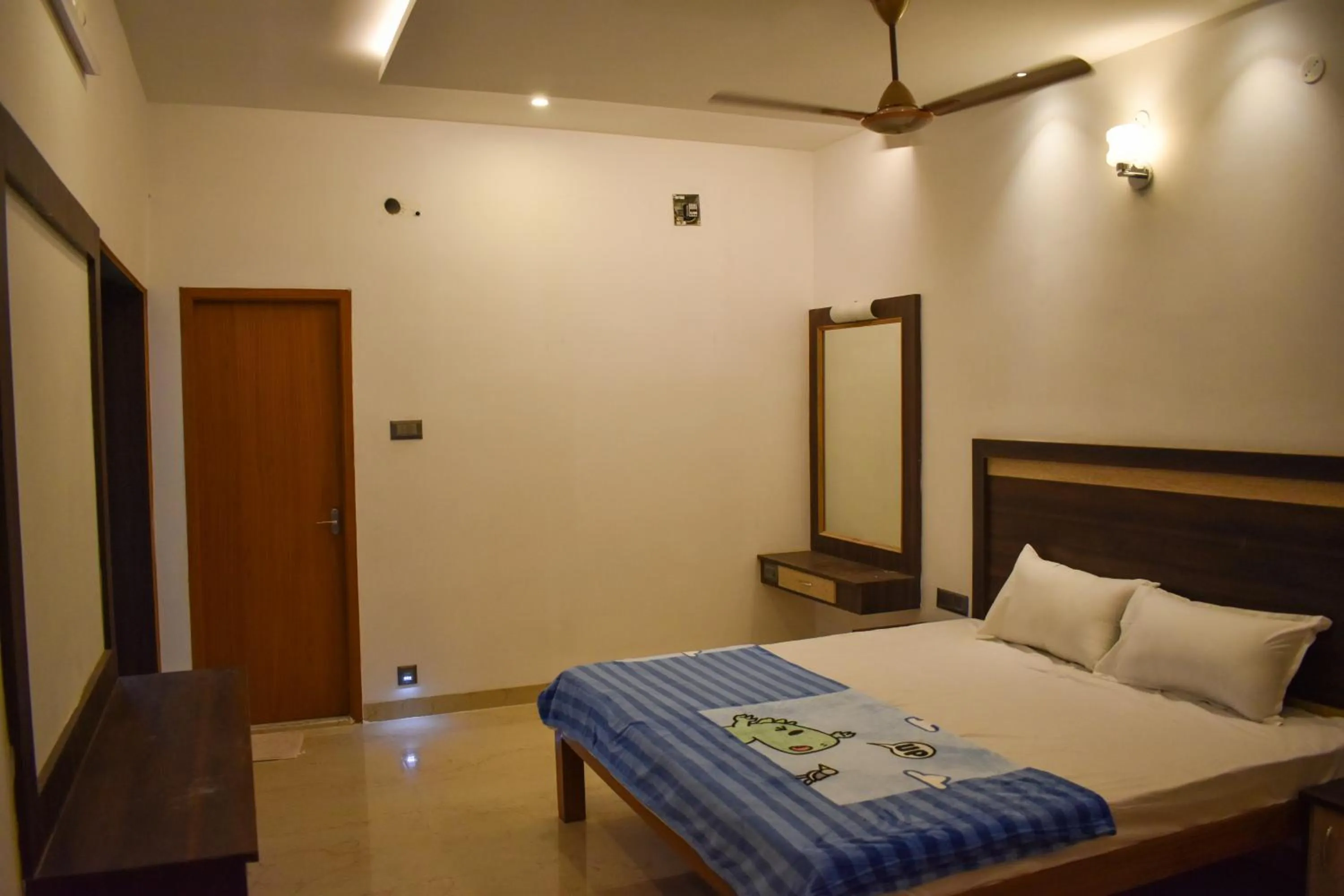 Bed in Bhavan Resorts