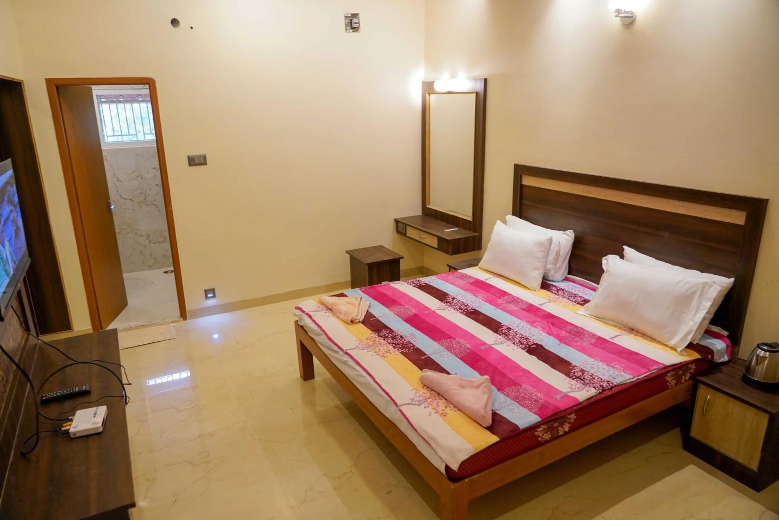 Bed in Bhavan Resorts