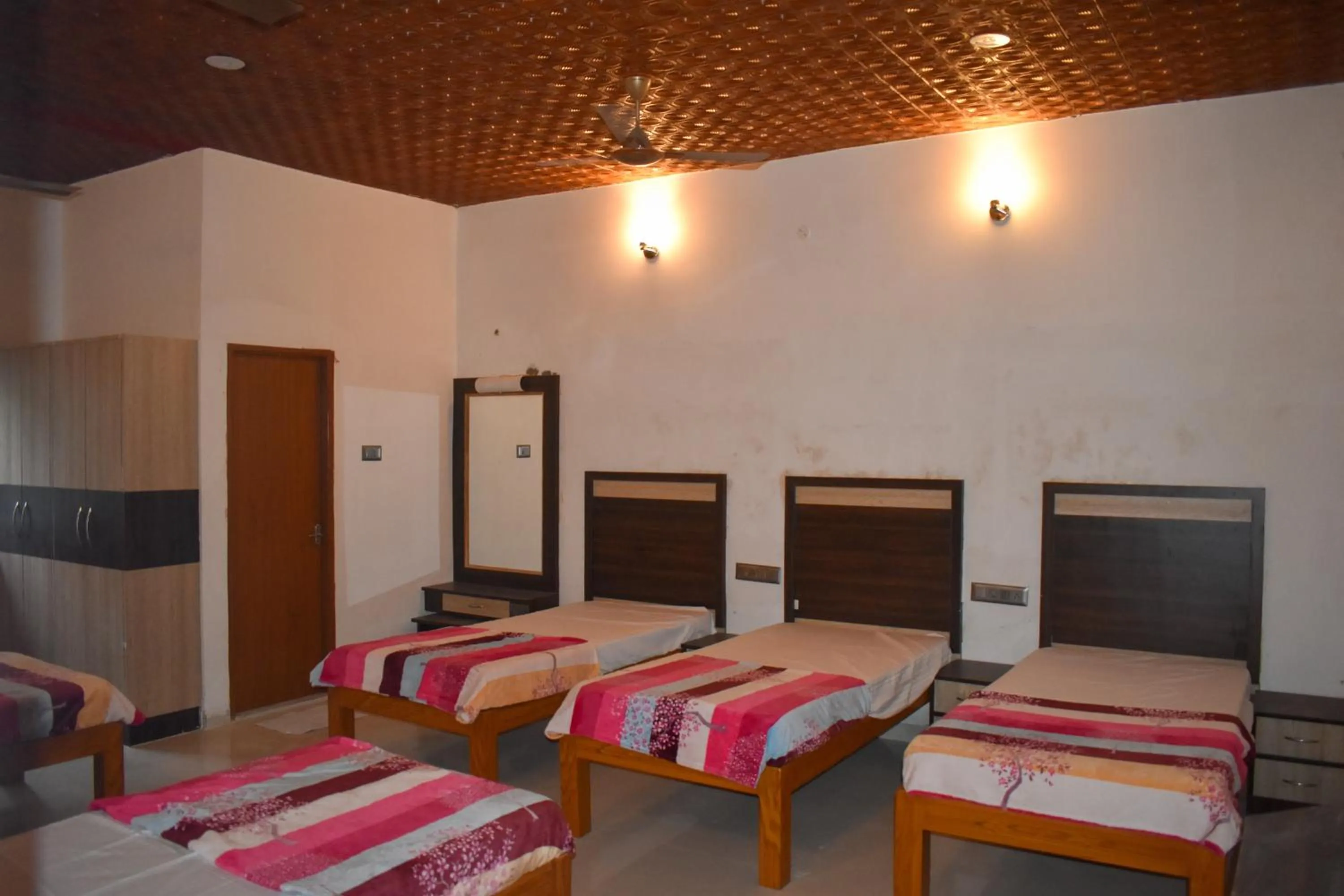 Bed in Bhavan Resorts