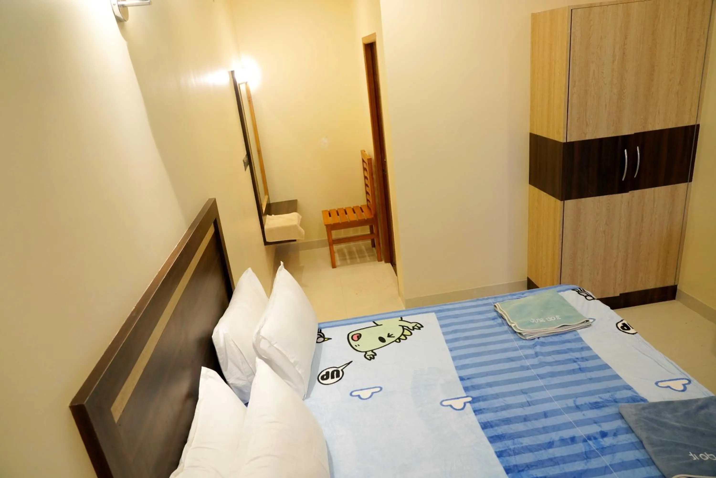 Bed in Bhavan Resorts