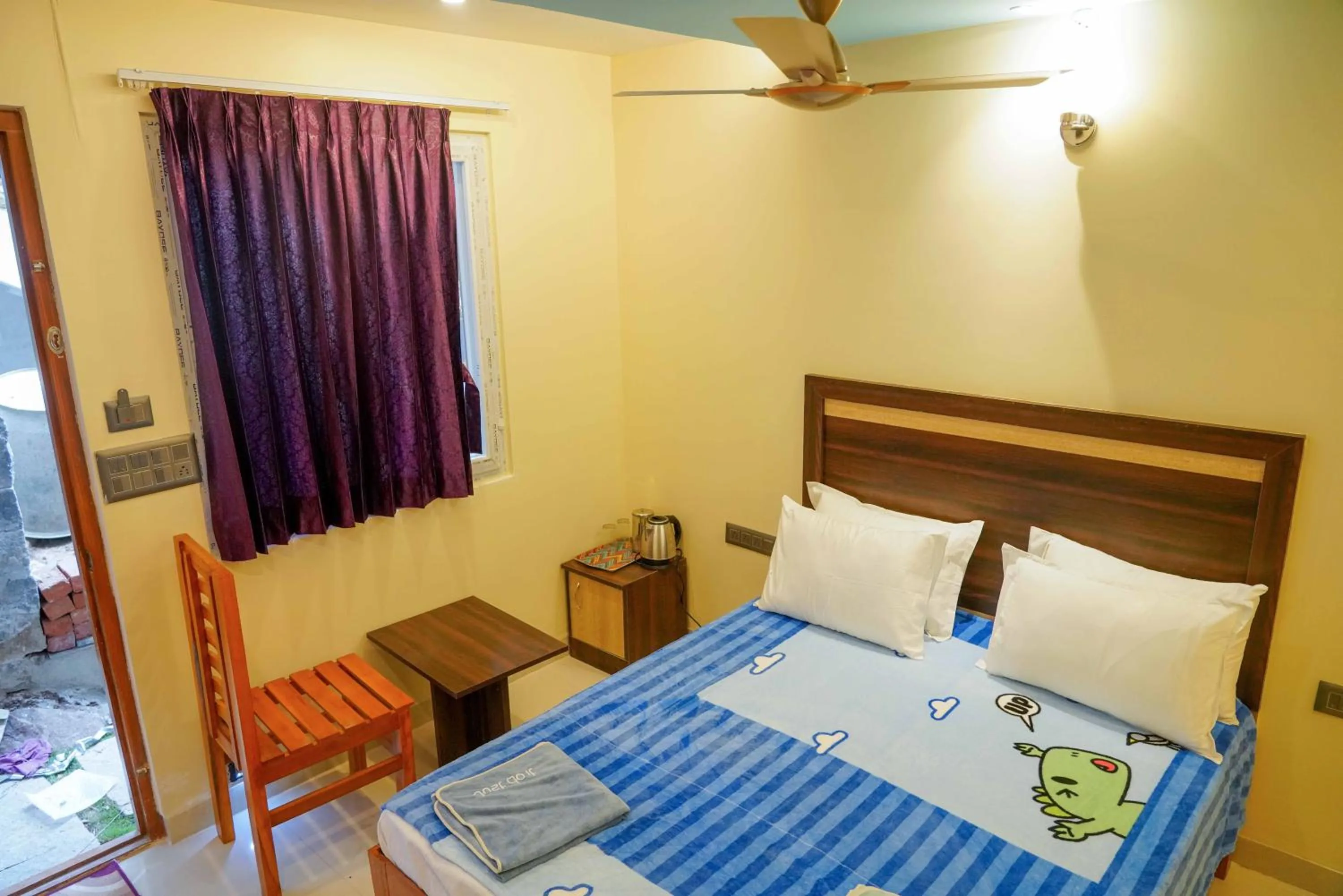 Bed in Bhavan Resorts