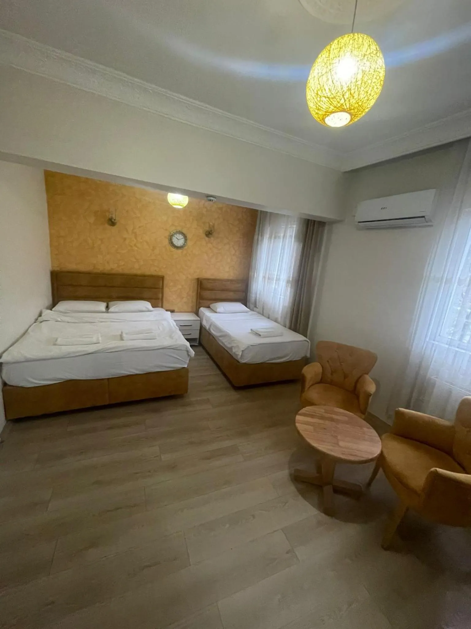 Bed in AVRASYAQUEEN HOTEL