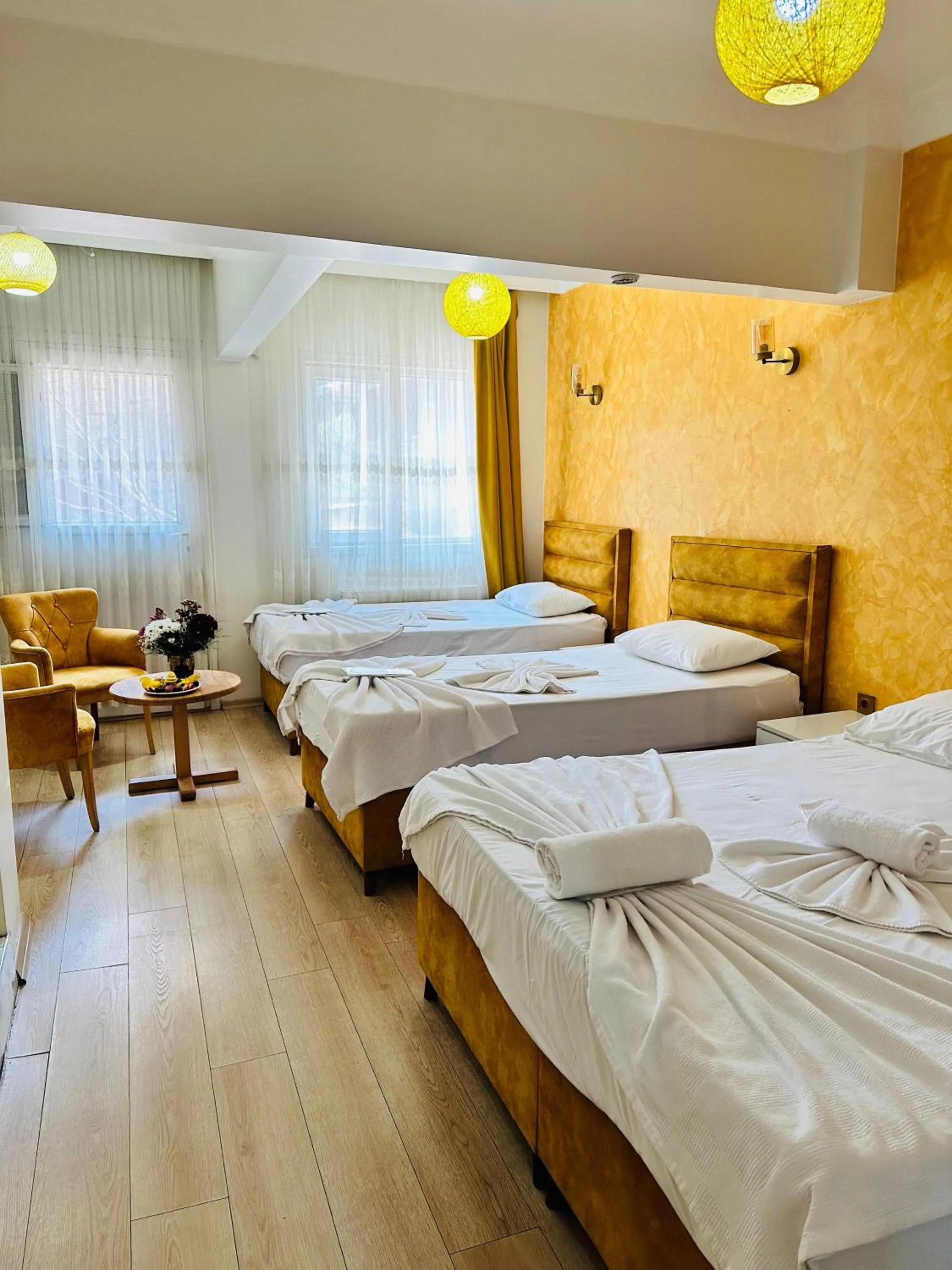 Bed in AVRASYAQUEEN HOTEL