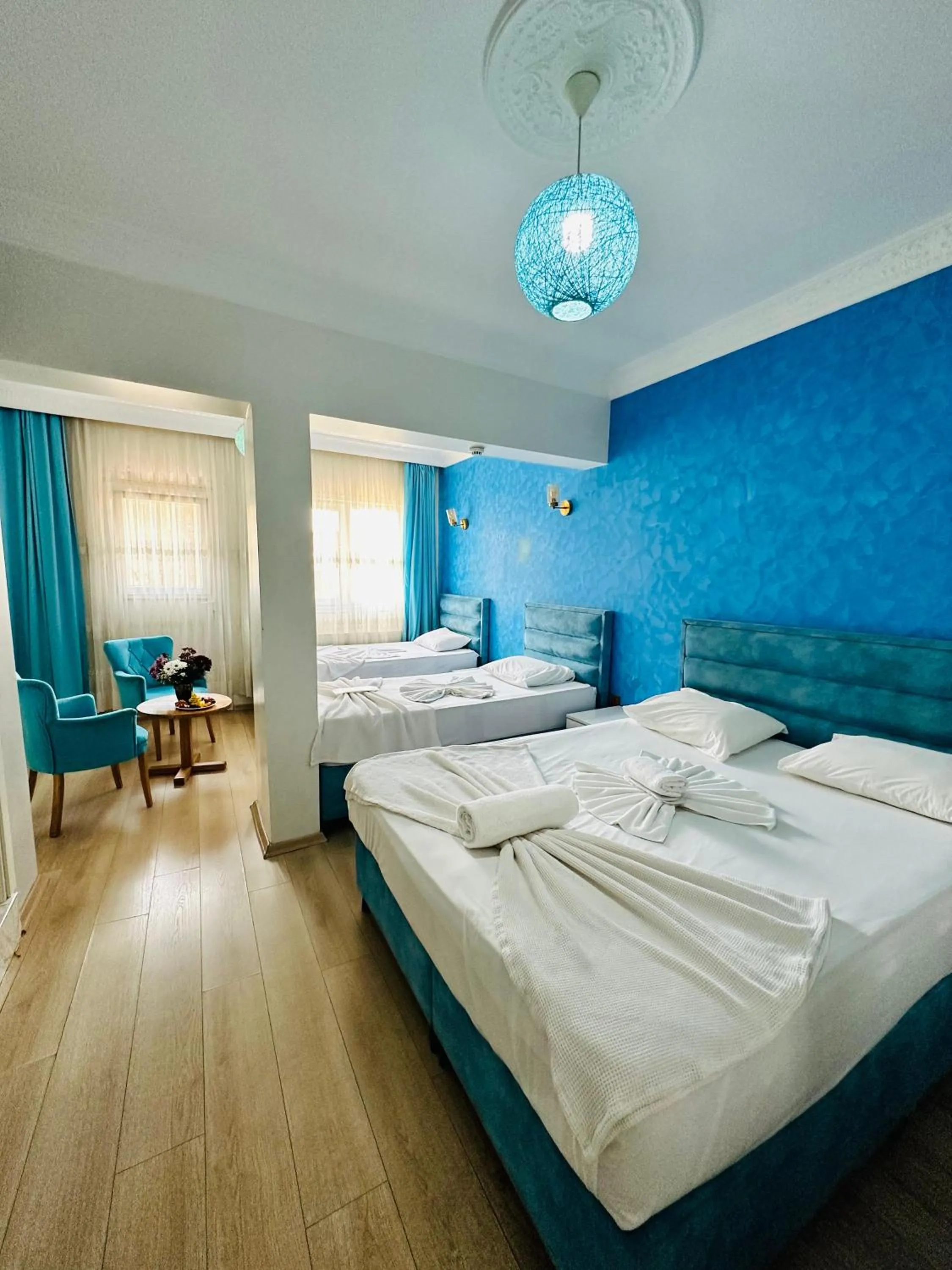 Bed in AVRASYAQUEEN HOTEL