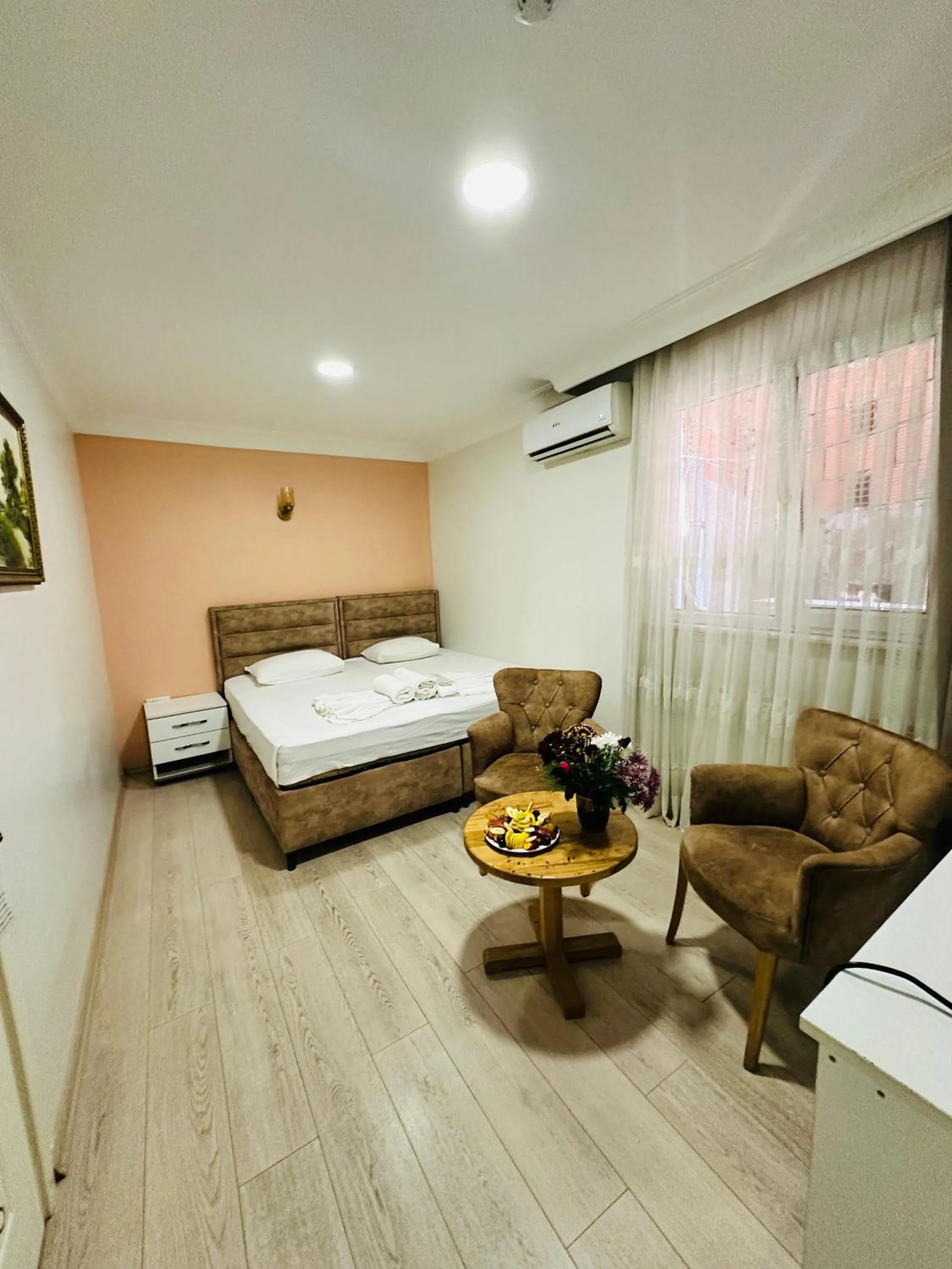 Bed in AVRASYAQUEEN HOTEL