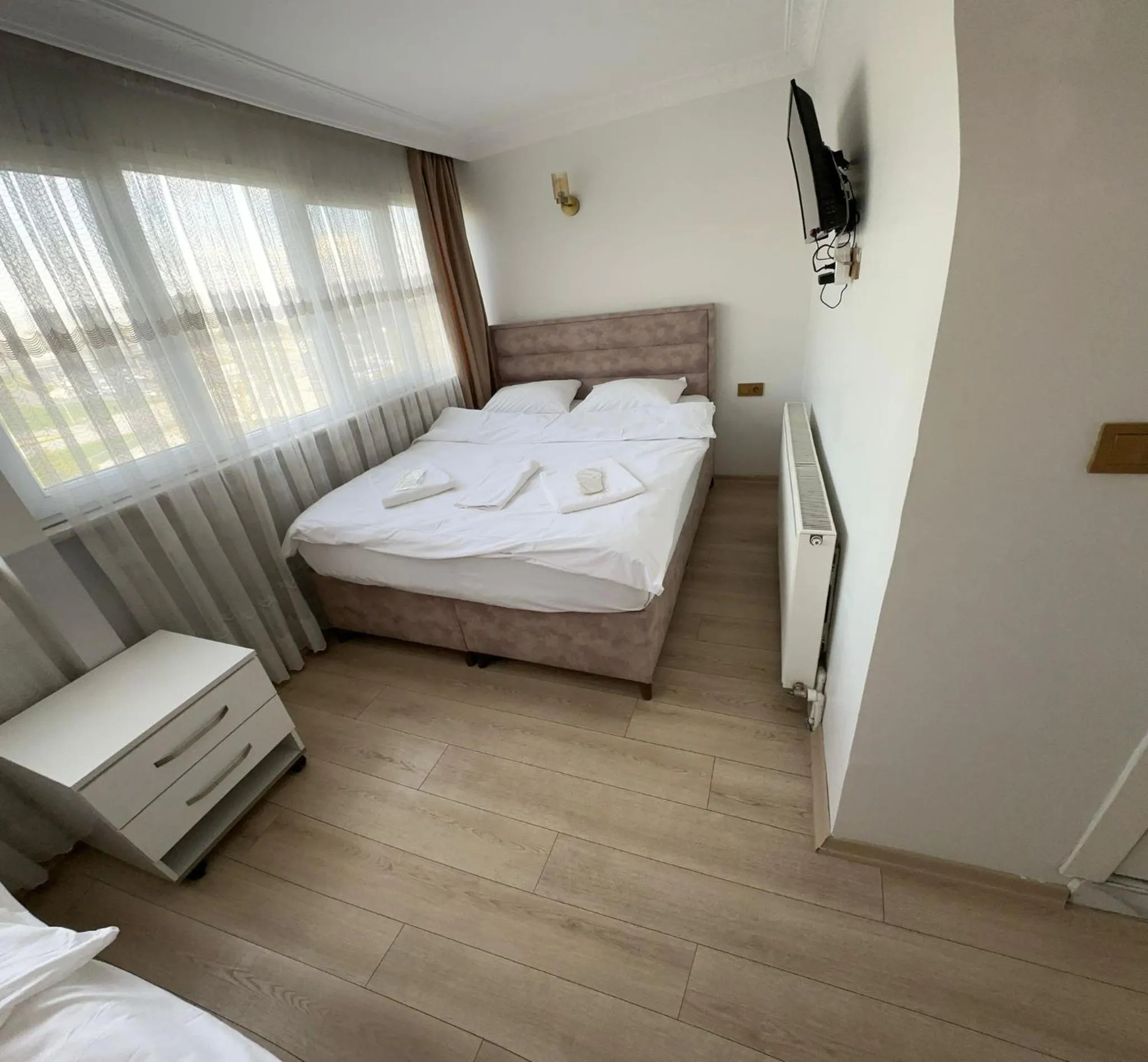 Bed in AVRASYAQUEEN HOTEL